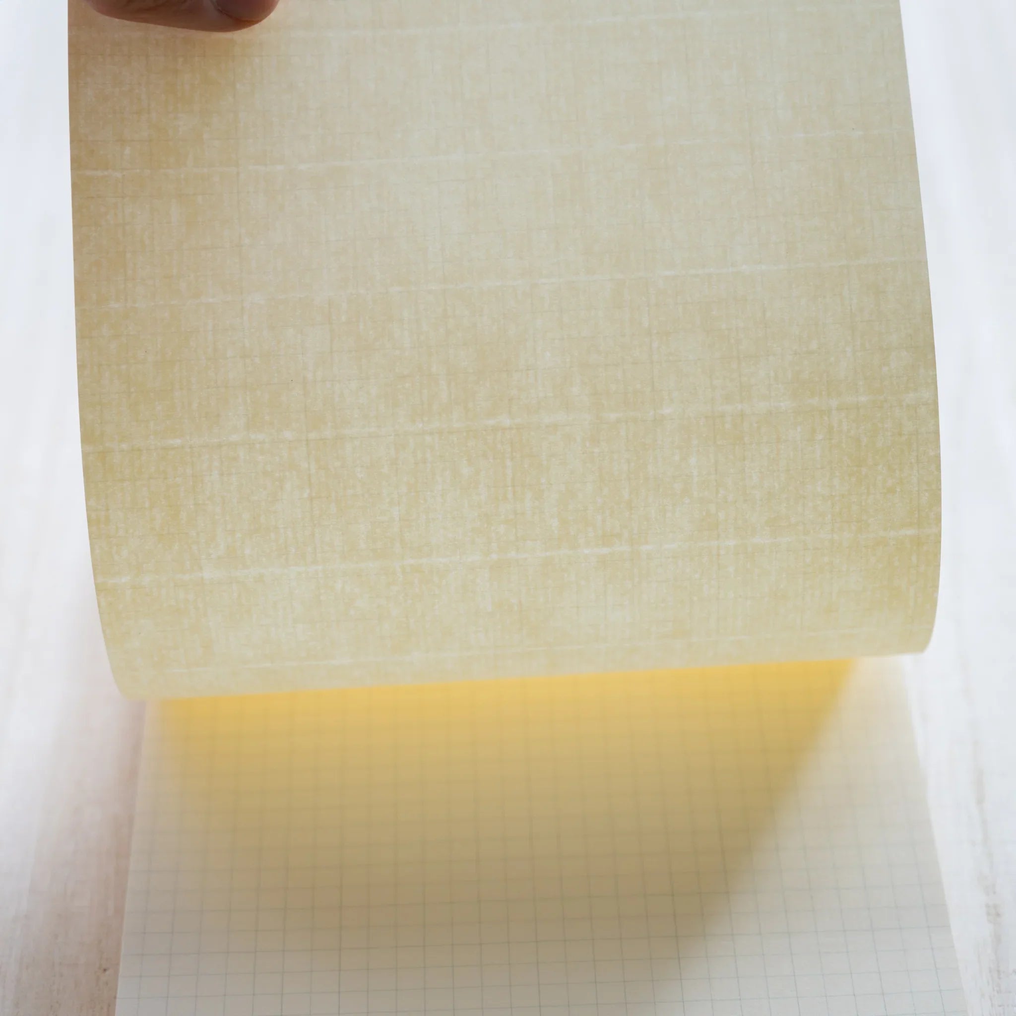 Life Noble A5 writing pad with stylized cover, overhead display demonstrating paper quality