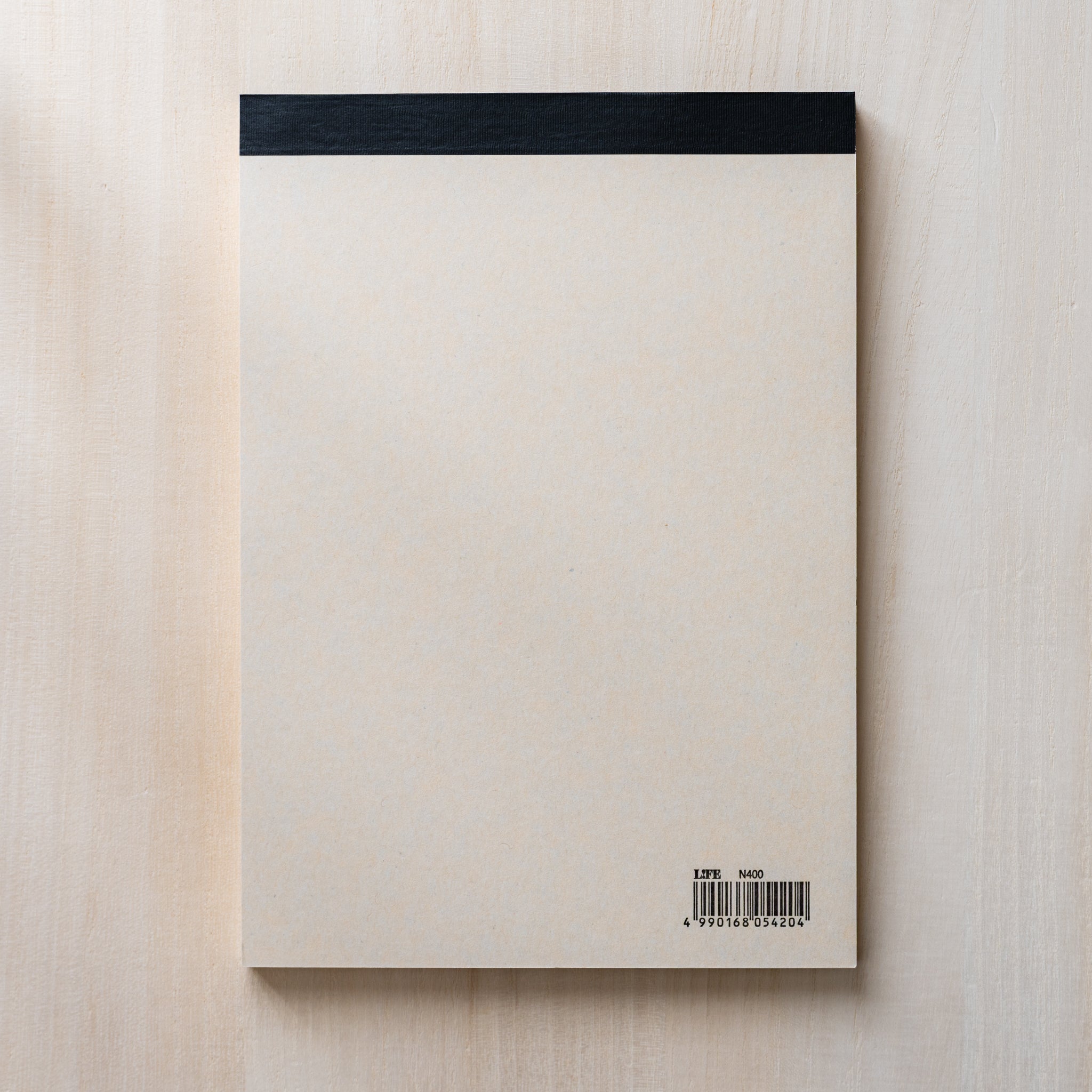 Life Noble writing pad back cover with plain cream paper and black top binding, minimalist Japanese stationery pad design