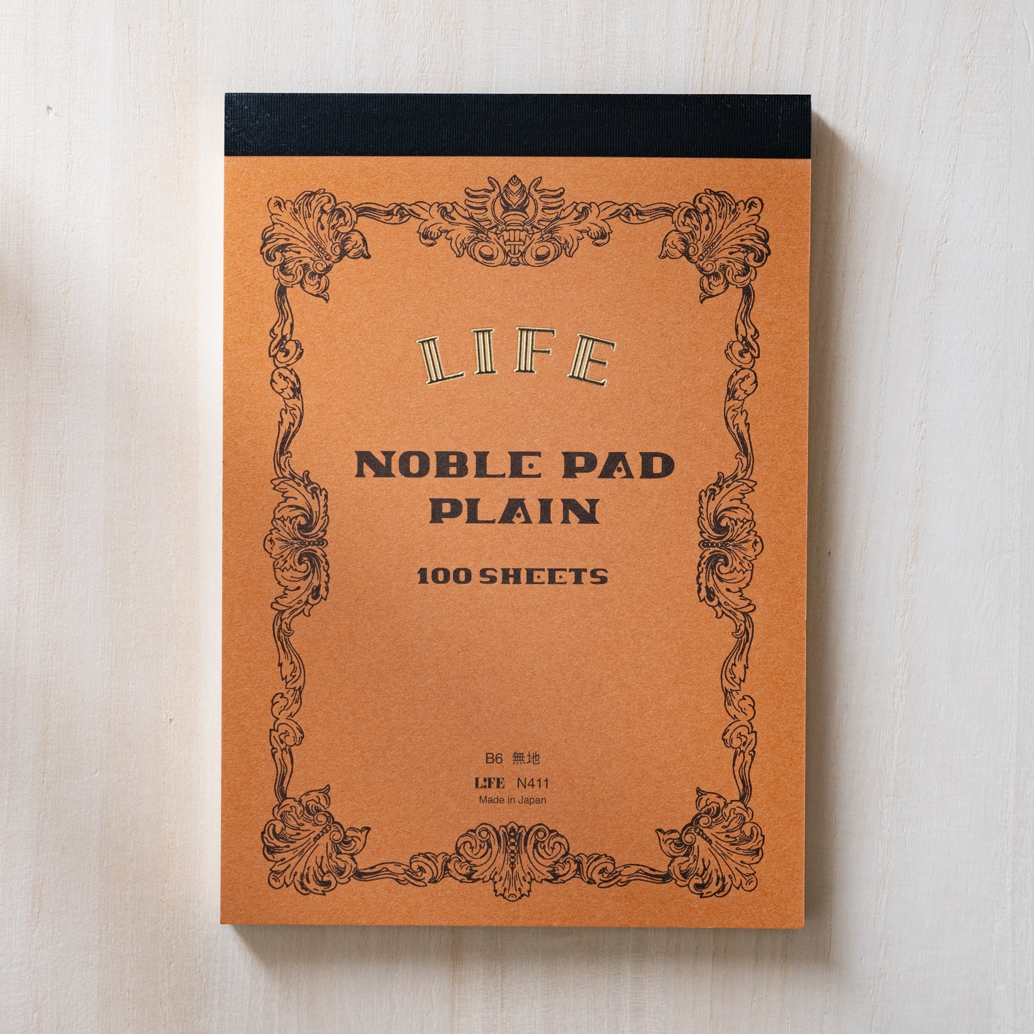 Life Noble writing pad B6 with multiple color covers stacked, showcasing premium Japanese paper for creative notes