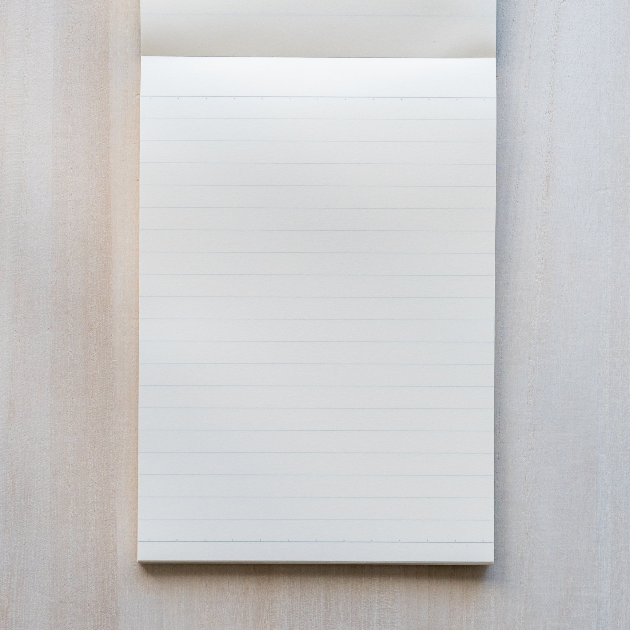 Life noble writing pad B6 ruled page shown from above, cream L Writing Paper with fine horizontal lines, minimal layout