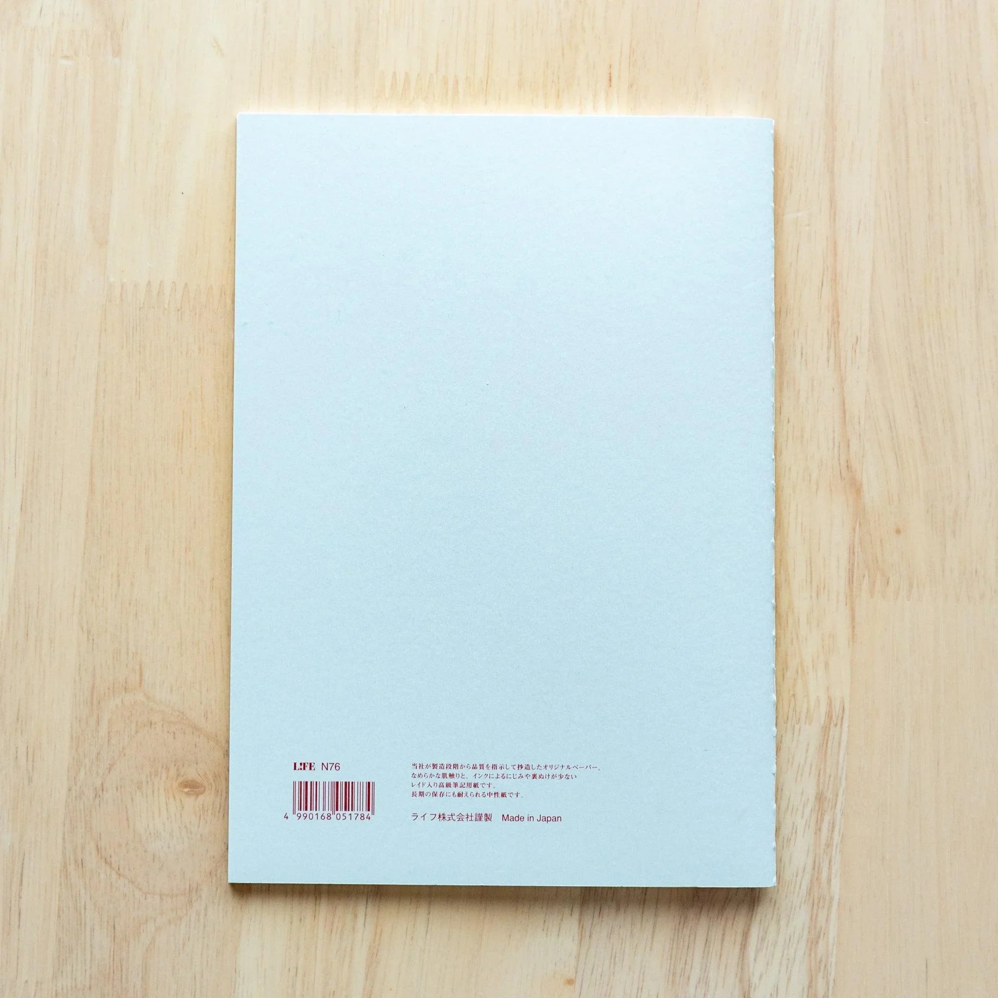 LIFE Pistachio journal with soft green tone, tilted view emphasizing color saturation and cover texture