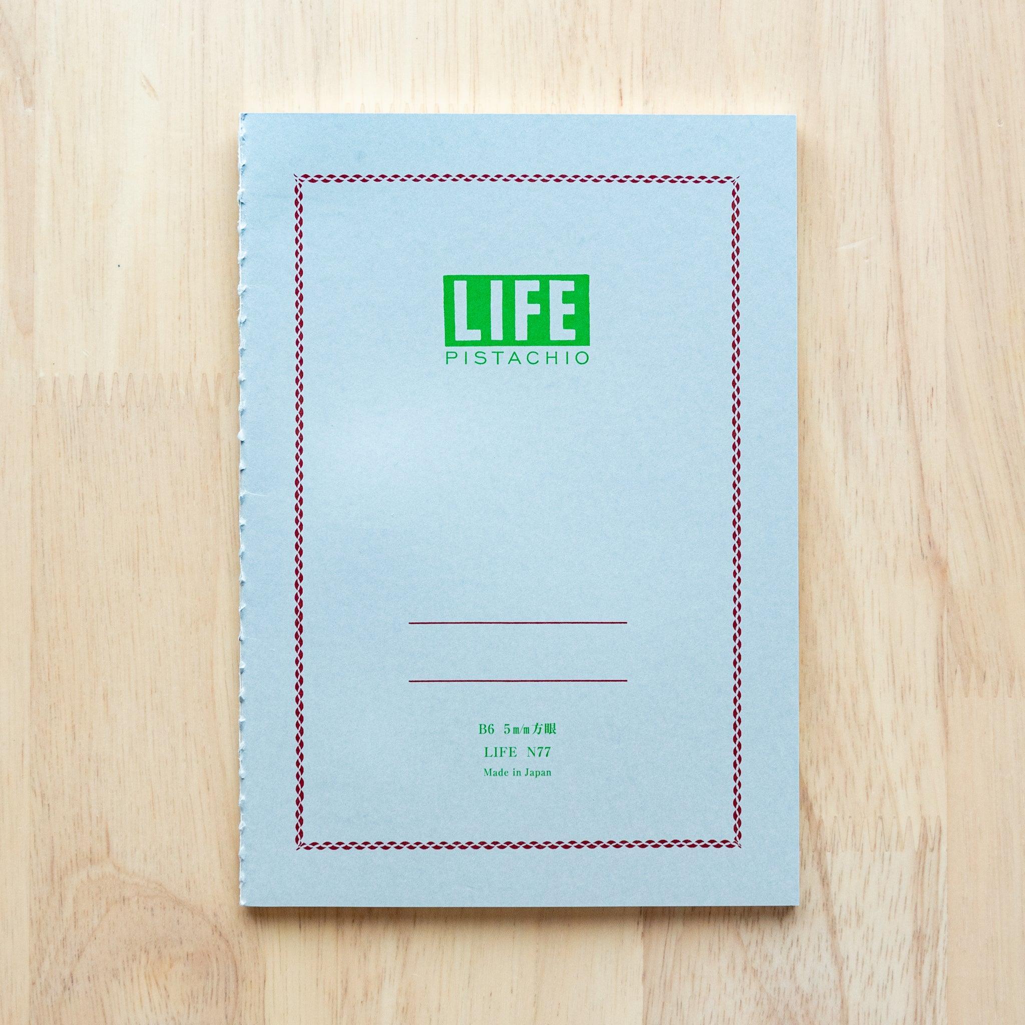 LIFE Pistachio A5 notebook, front and back cover comparison angle showing branding and green color tone