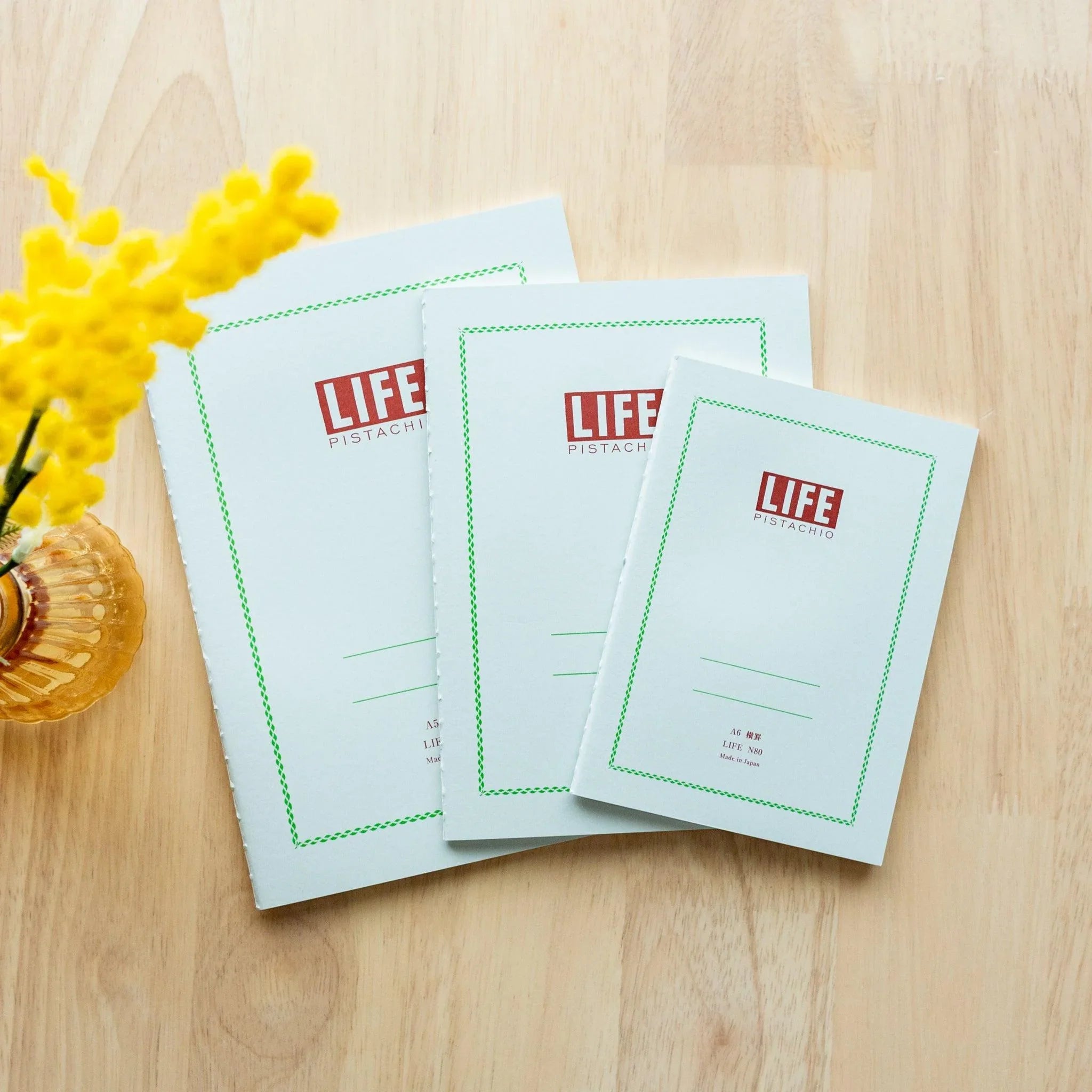 LIFE Pistachio notebook with quality pages, fully opened to center showing balanced page layout and design