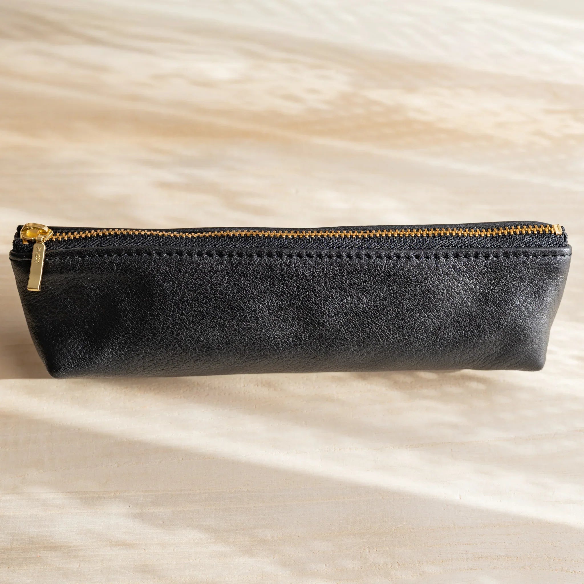 Pen case displayed showing capacity and proportions for multiple pens and features and features and features