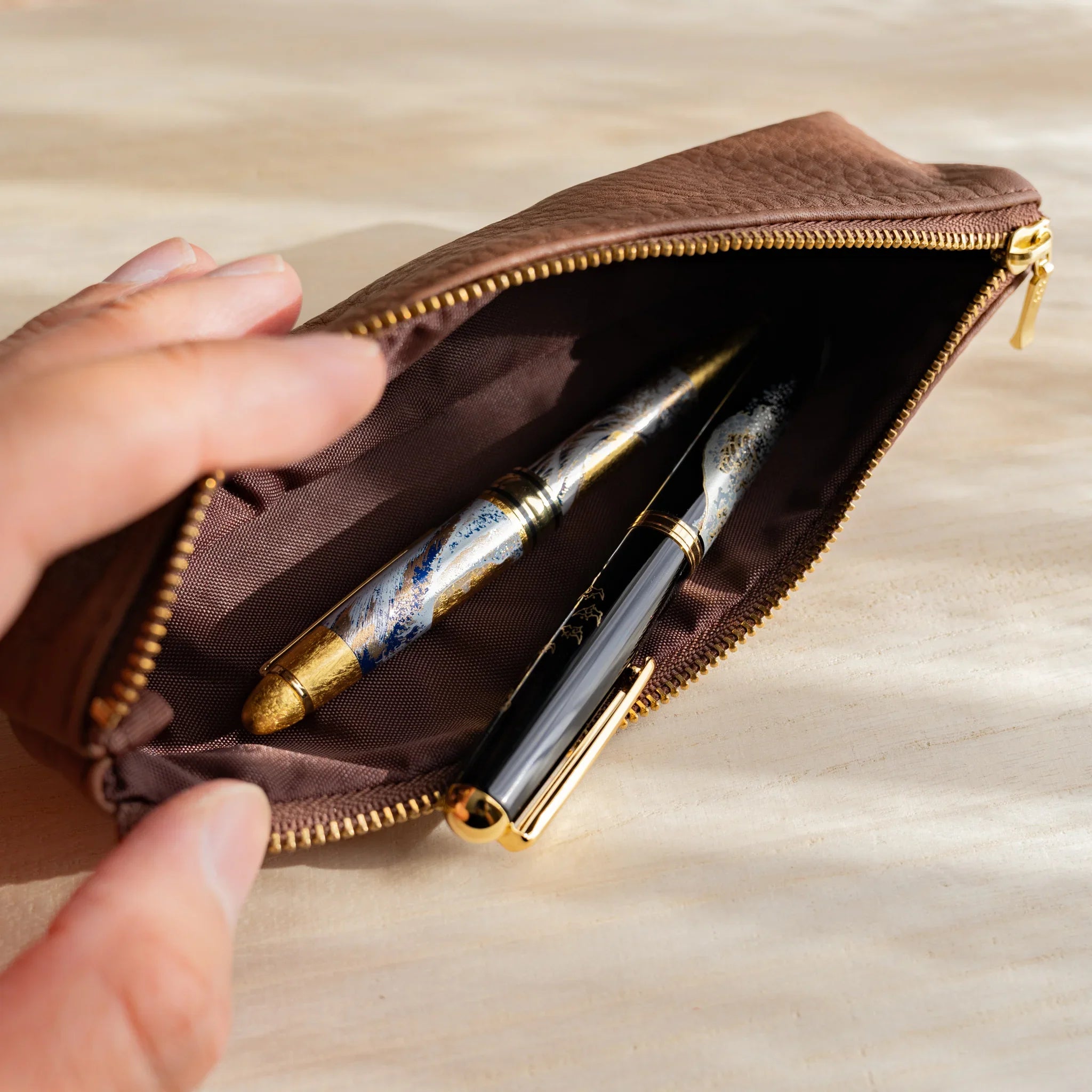 Brown leather pen case showing rich leather color and texture and features and features and features