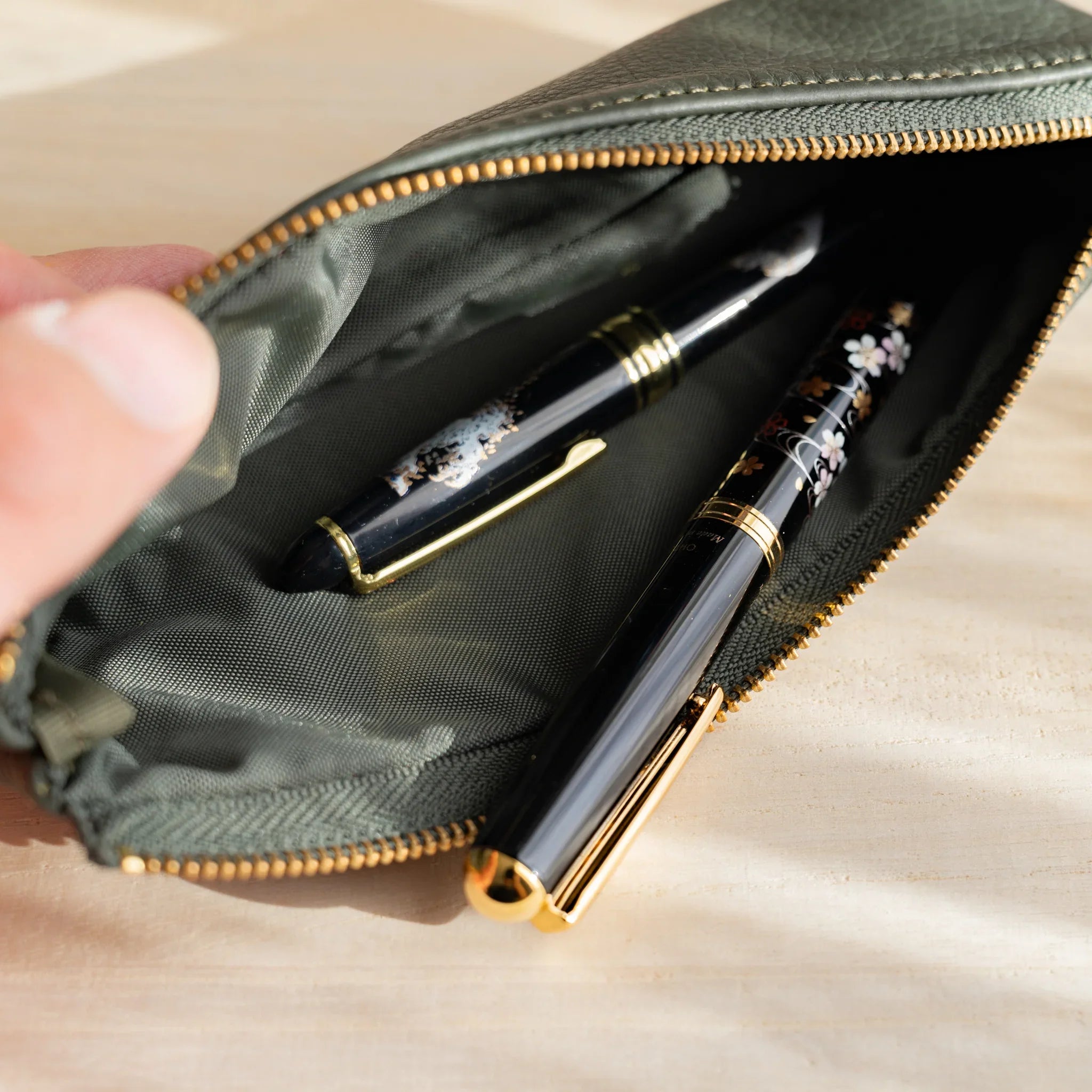 Green leather pen case showing vibrant color and steerhide material and features and features and features