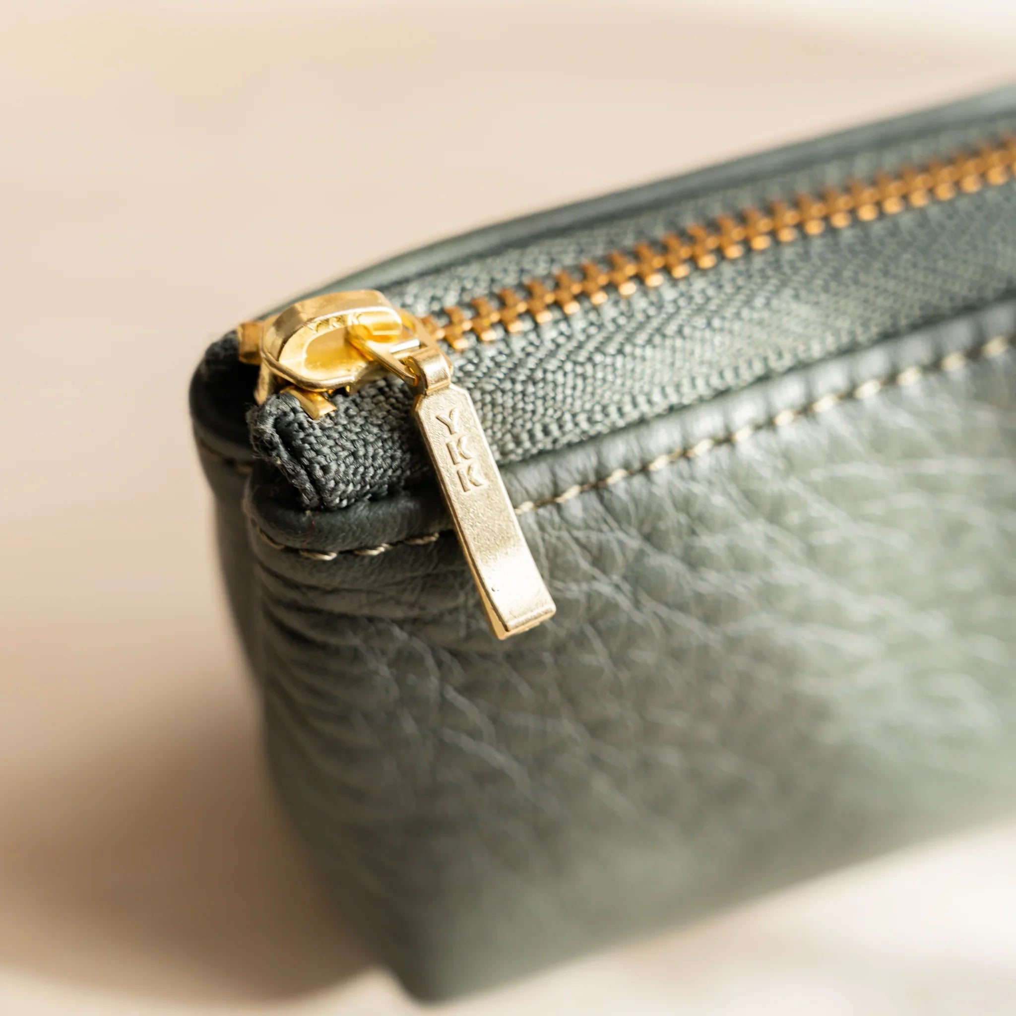 Side profile of green case showing cylindrical construction and features and features and features and features