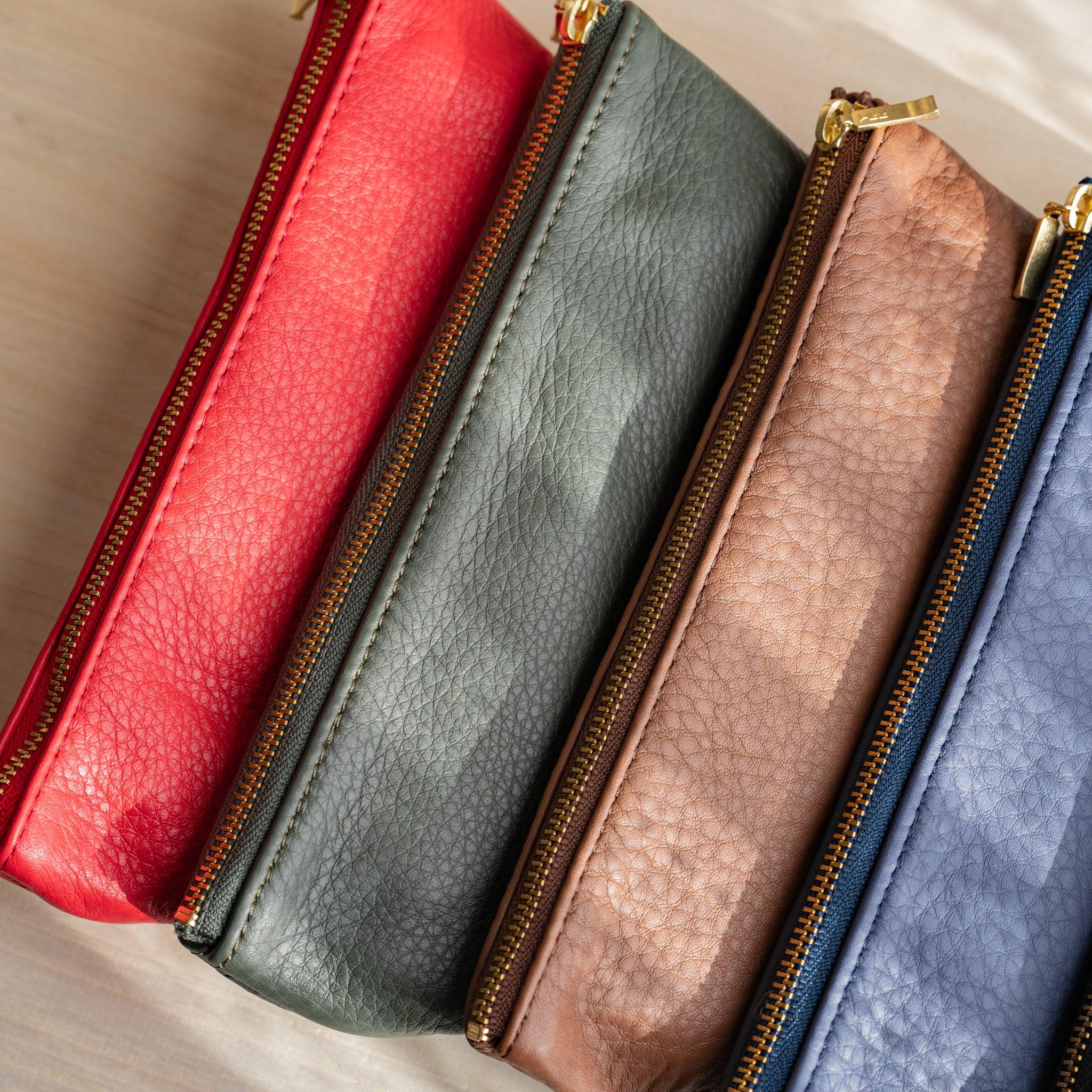 Pen case with writing instruments demonstrating practical use and features and features and features