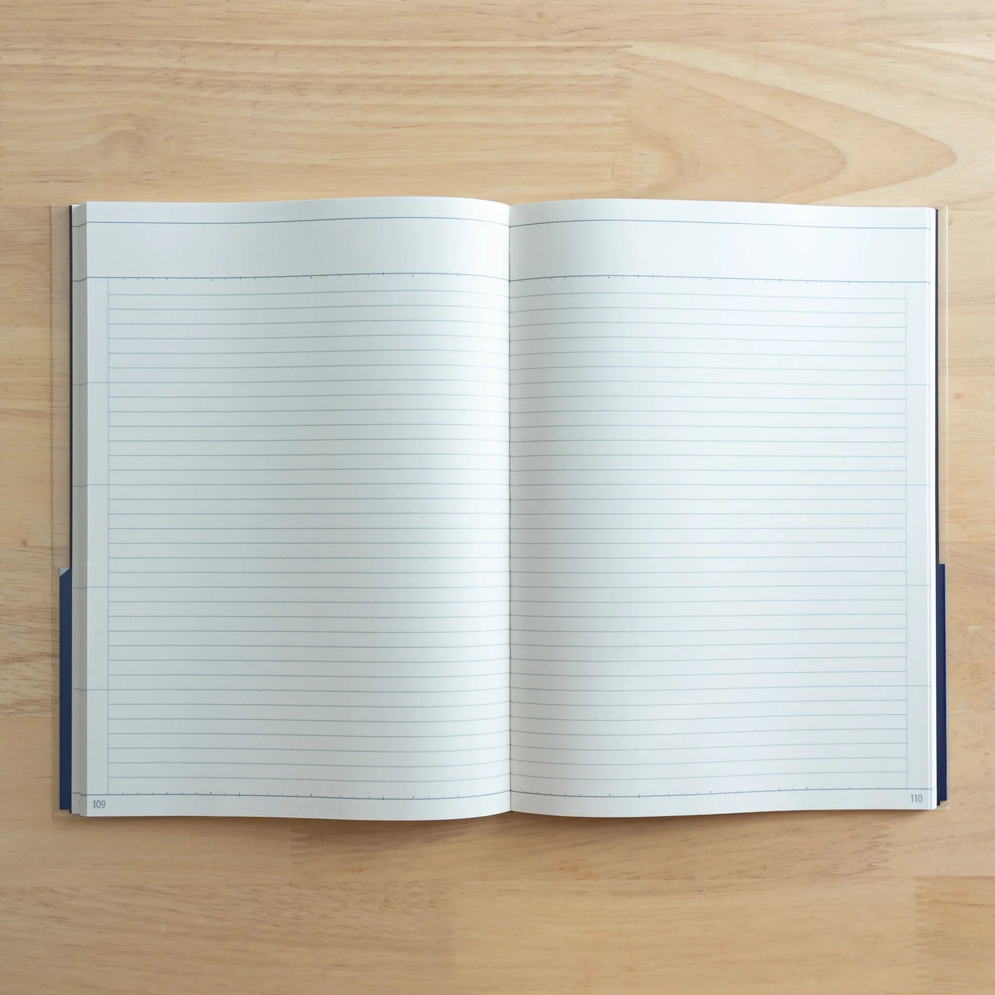 Logical Search Notebook open to blank double-page spread with fine Japanese ruled lines for note-taking