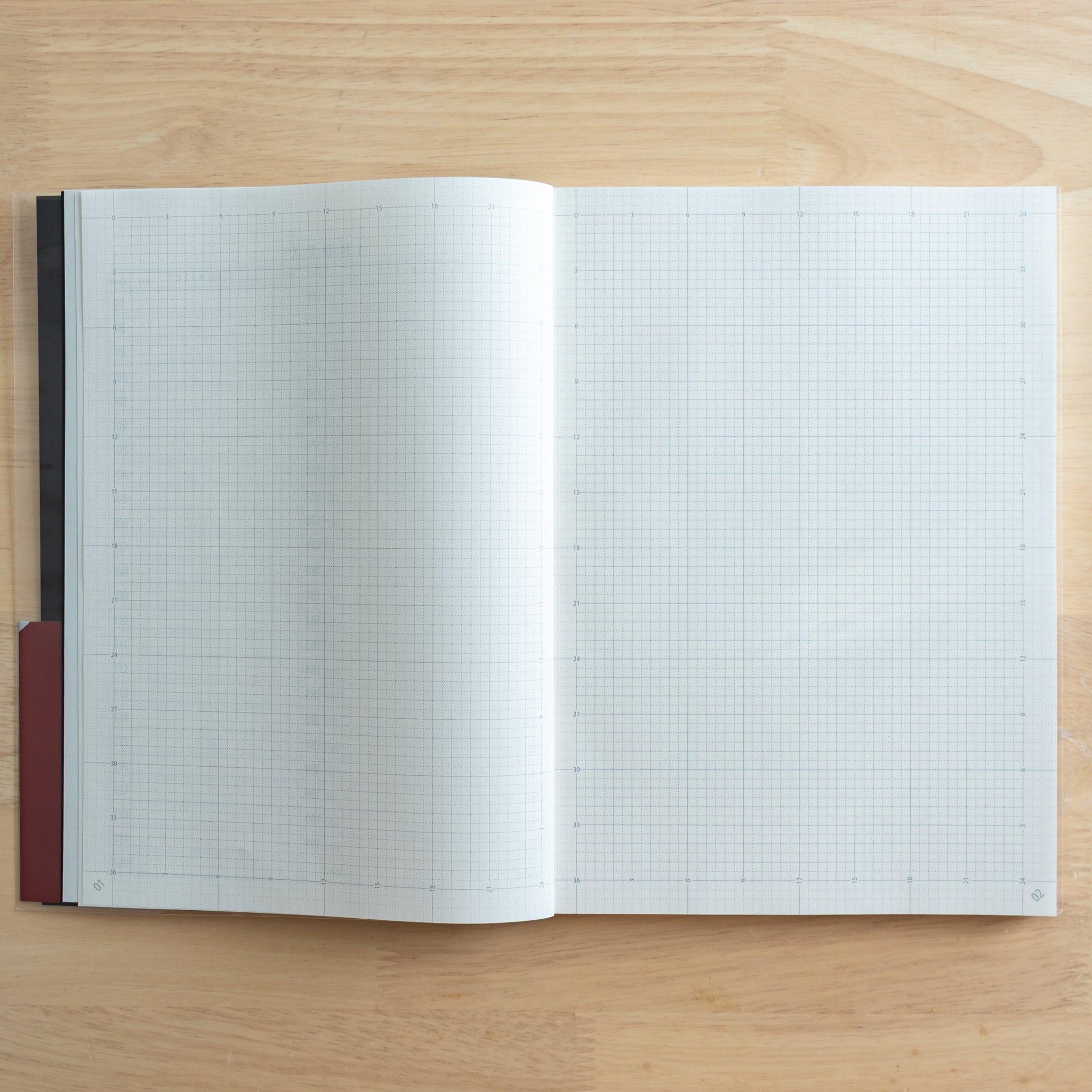An open Japanese "Logical Search" notebook showing its 3.2mm grid pages, designed for structured note-taking and planning.