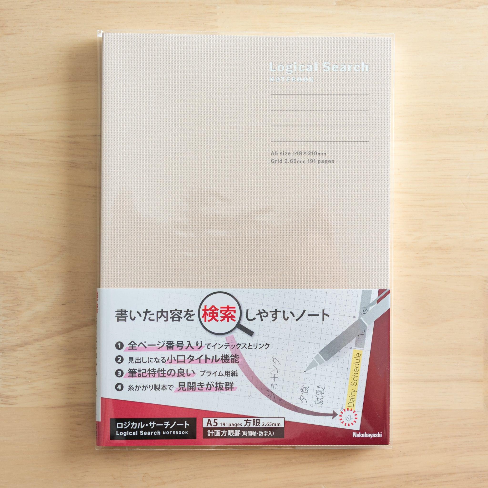 A5-sized Japanese "Logical Search" notebook with a light beige cover, featuring indexed and grid pages for organized note-taking.