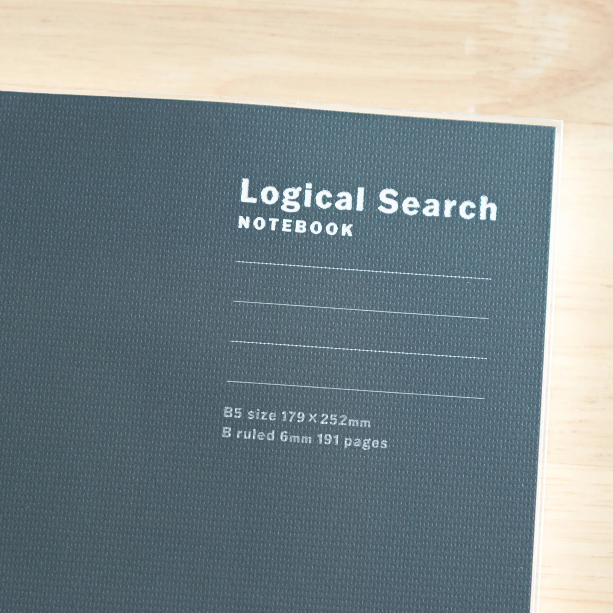Detailed close-up of Logical Search Notebook front cover showing textured Japanese paper surface finish