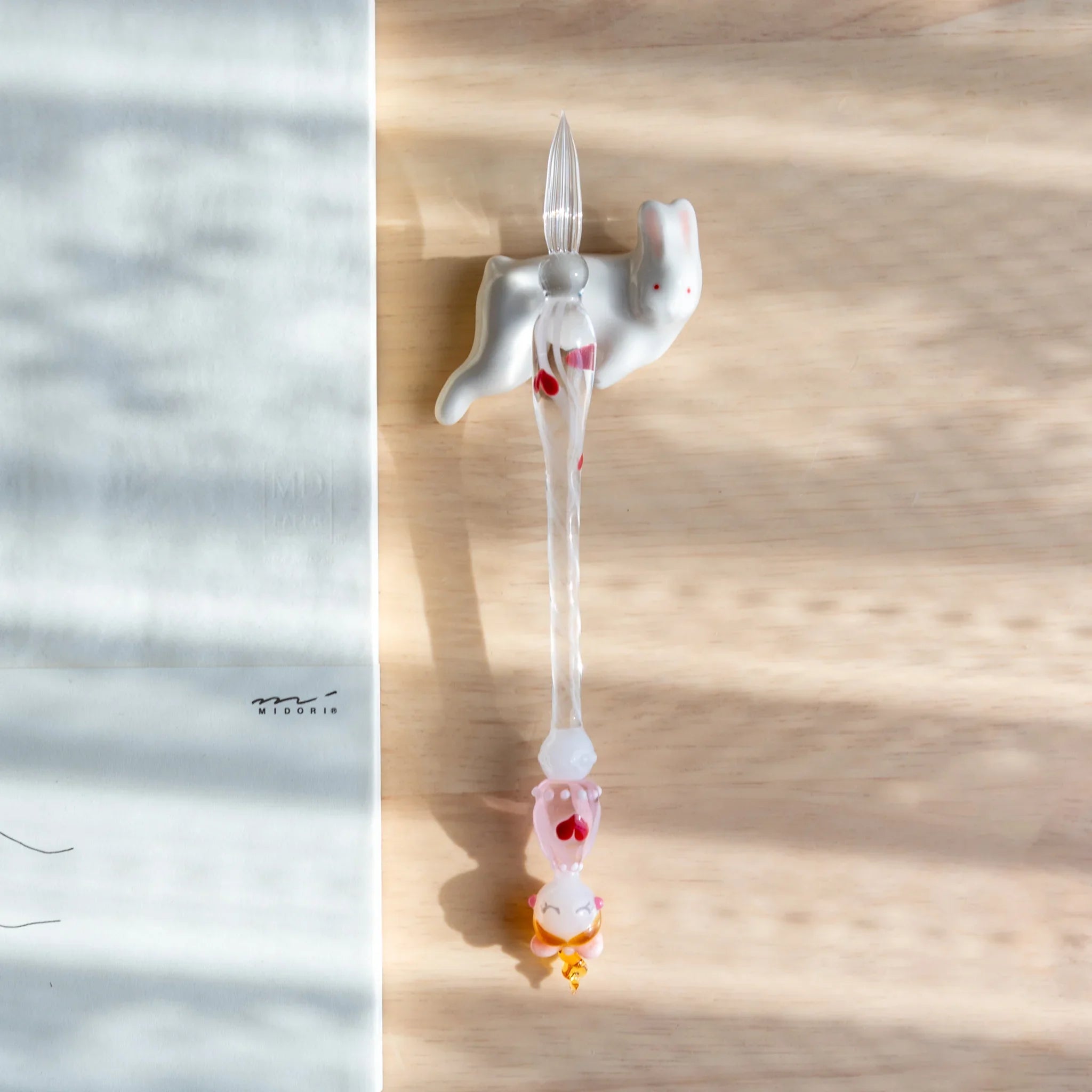 Gray lying rabbit ceramic pen rest Japanese handcrafted with animal posture close shot