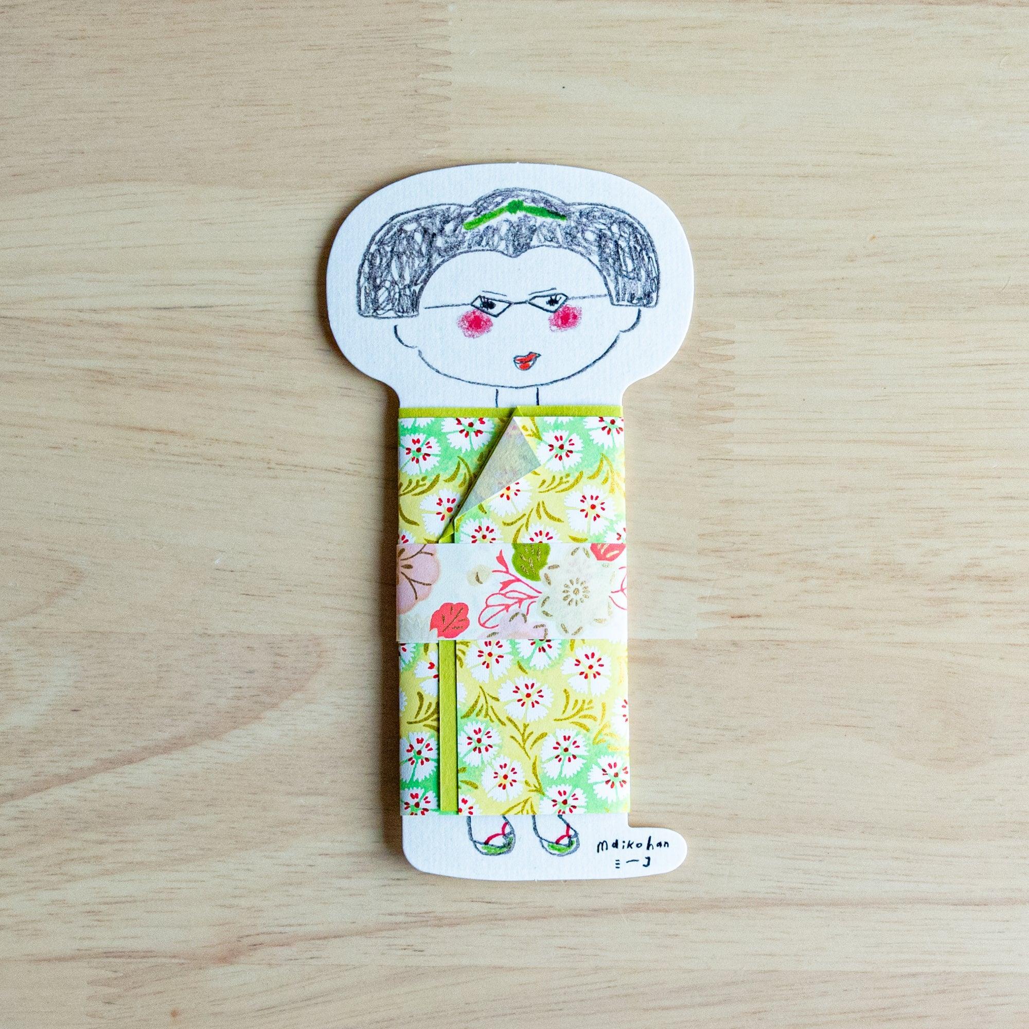 Maikohan Message Card on wood, gray-haired maiko figure with green hair ornament and yellow-green yuzen washi floral kimono