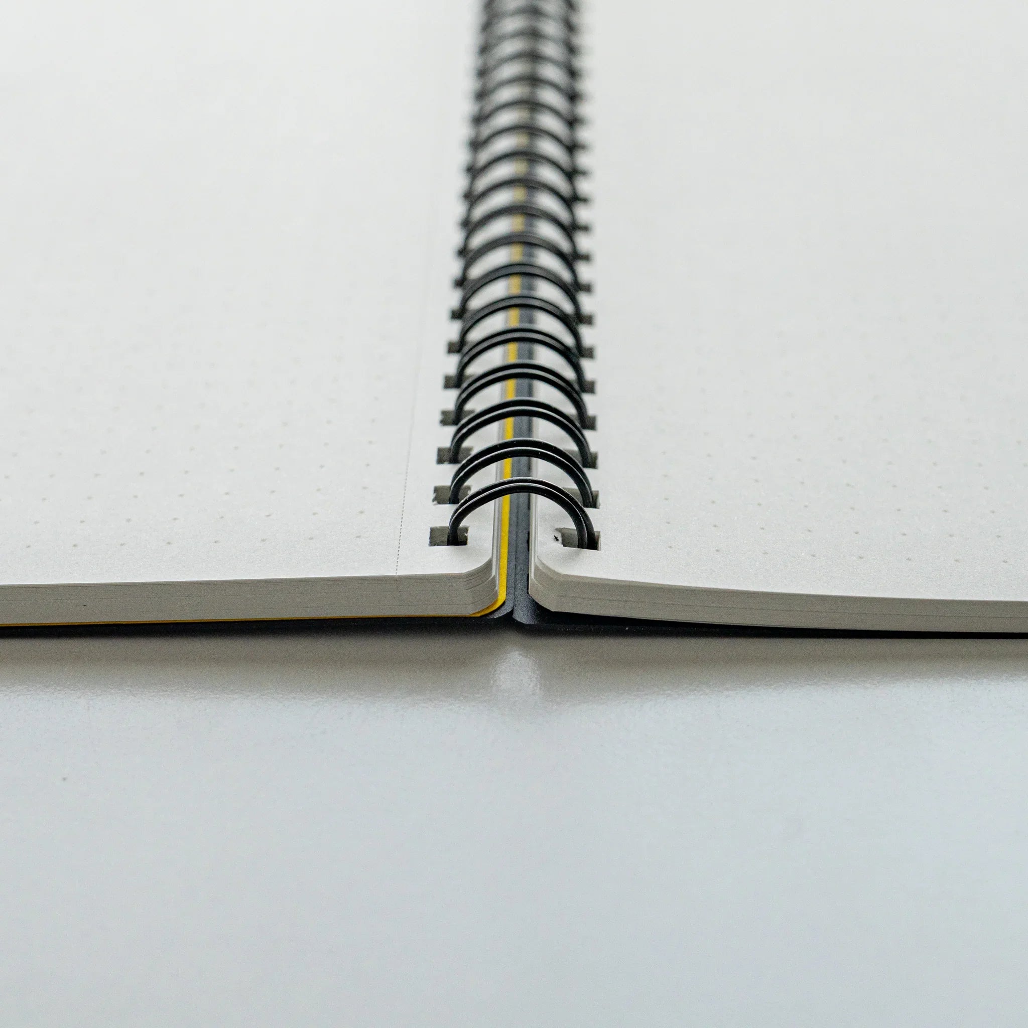 Maruman Mnemosyne notebook, flat lay of closed white Mnemosyne notebook, Japanese Mnemosyne A5 5mm dot grid pad with smooth