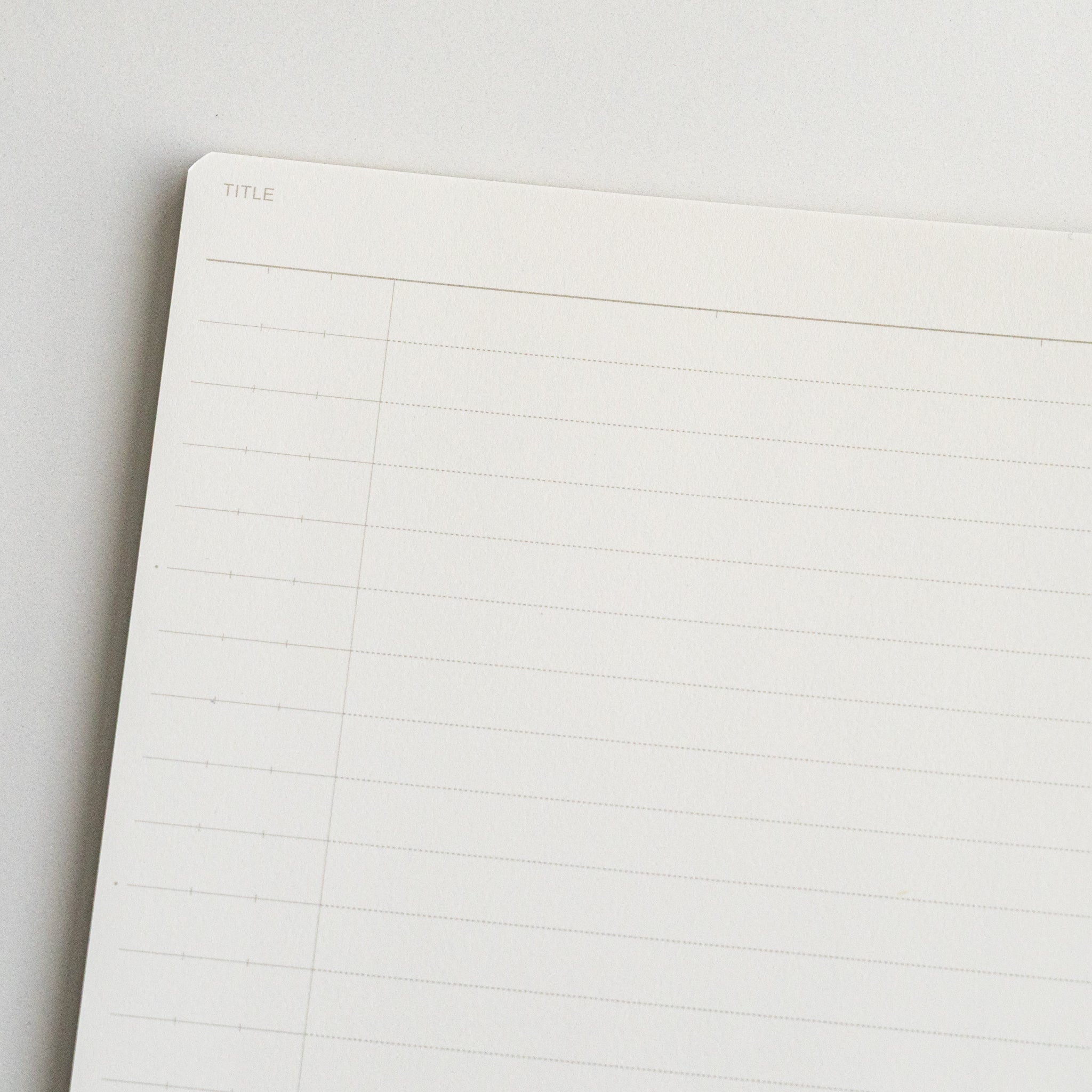 Close-up of Mnemosyne lined notebook page with smooth white paper, 8 mm ruling and a title section for neat note-taking.