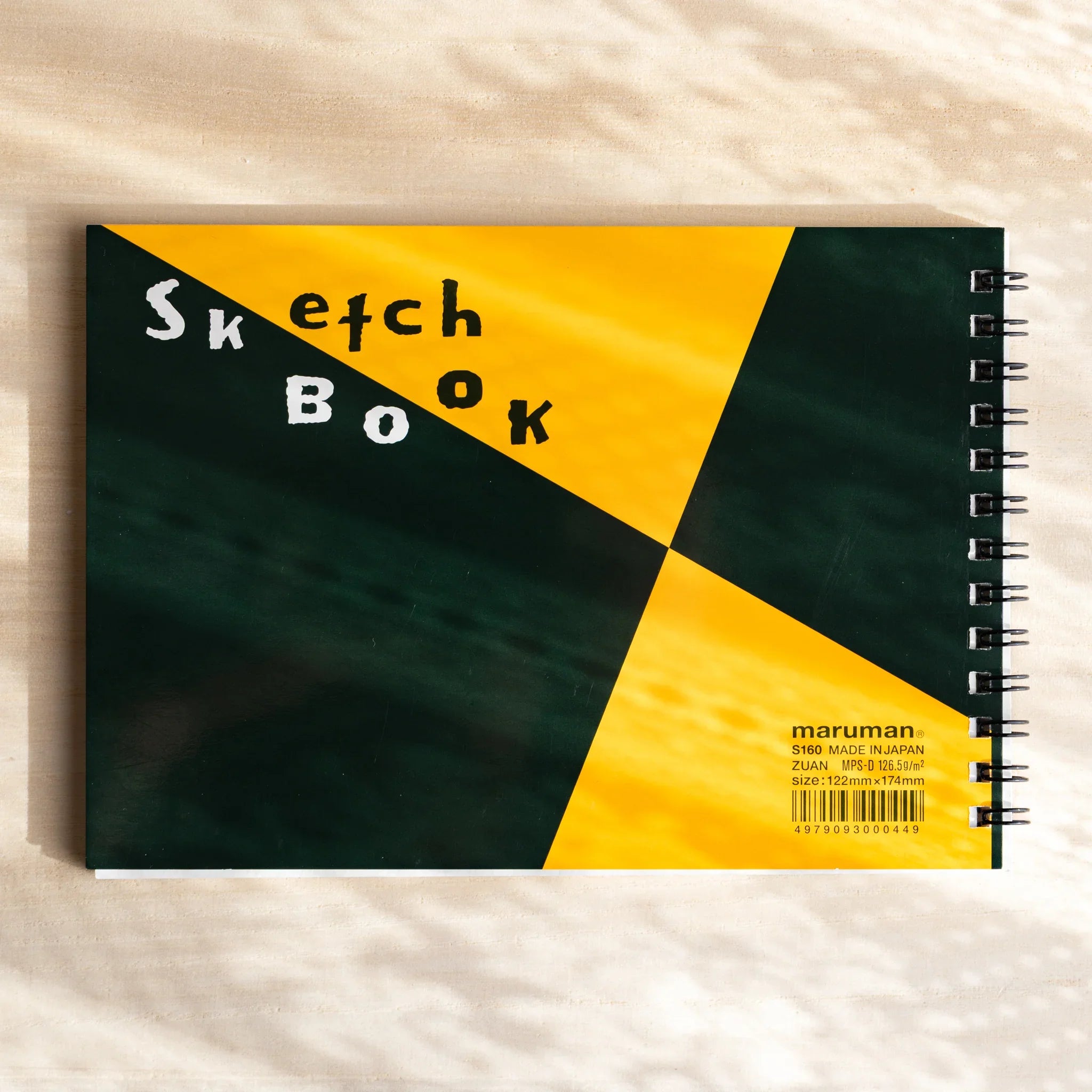 Maruman Zuan sketchbook, angled view highlighting ring binding detail, stationery item from Japan with quality construction