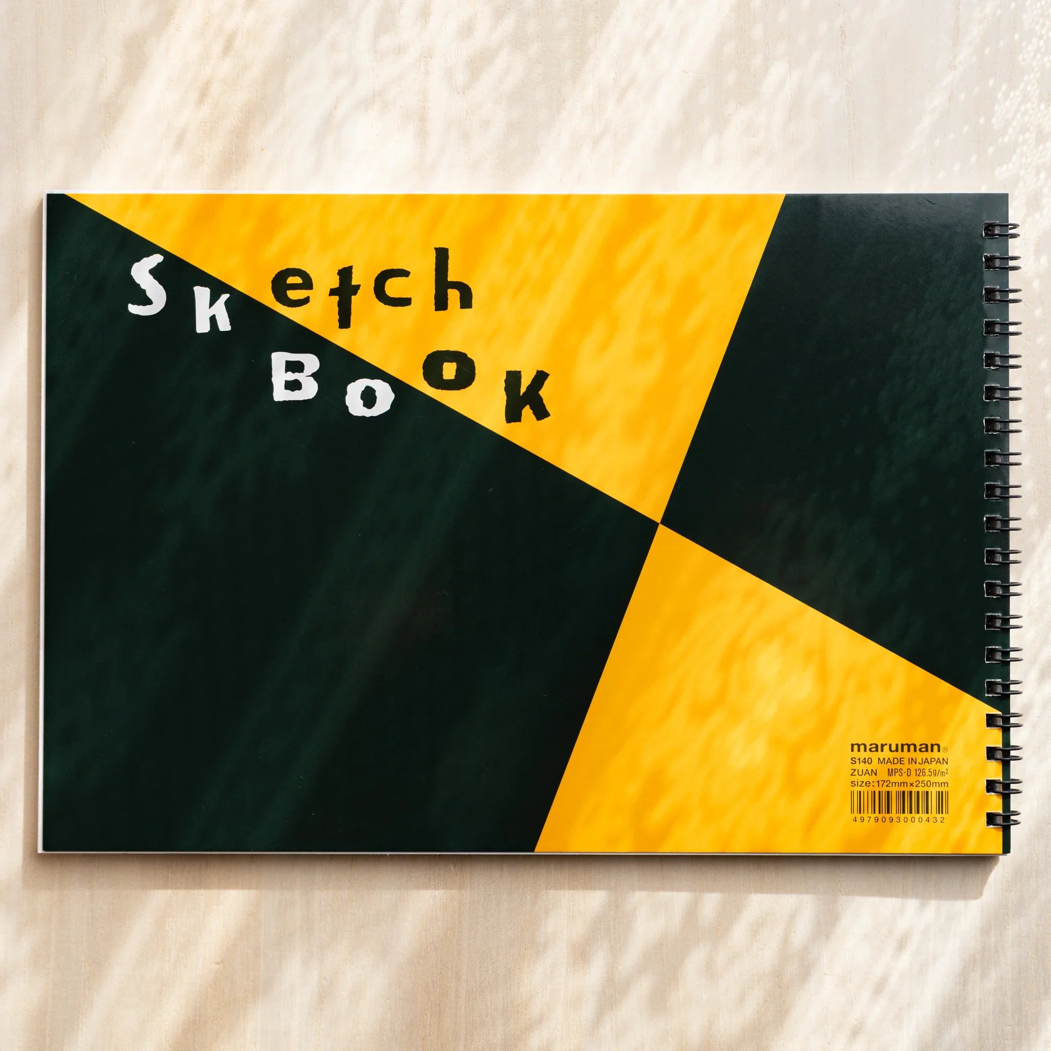 Maruman Zuan sketchbook, opened pages revealing sketch paper texture, Japanese stationery item with quality construction and