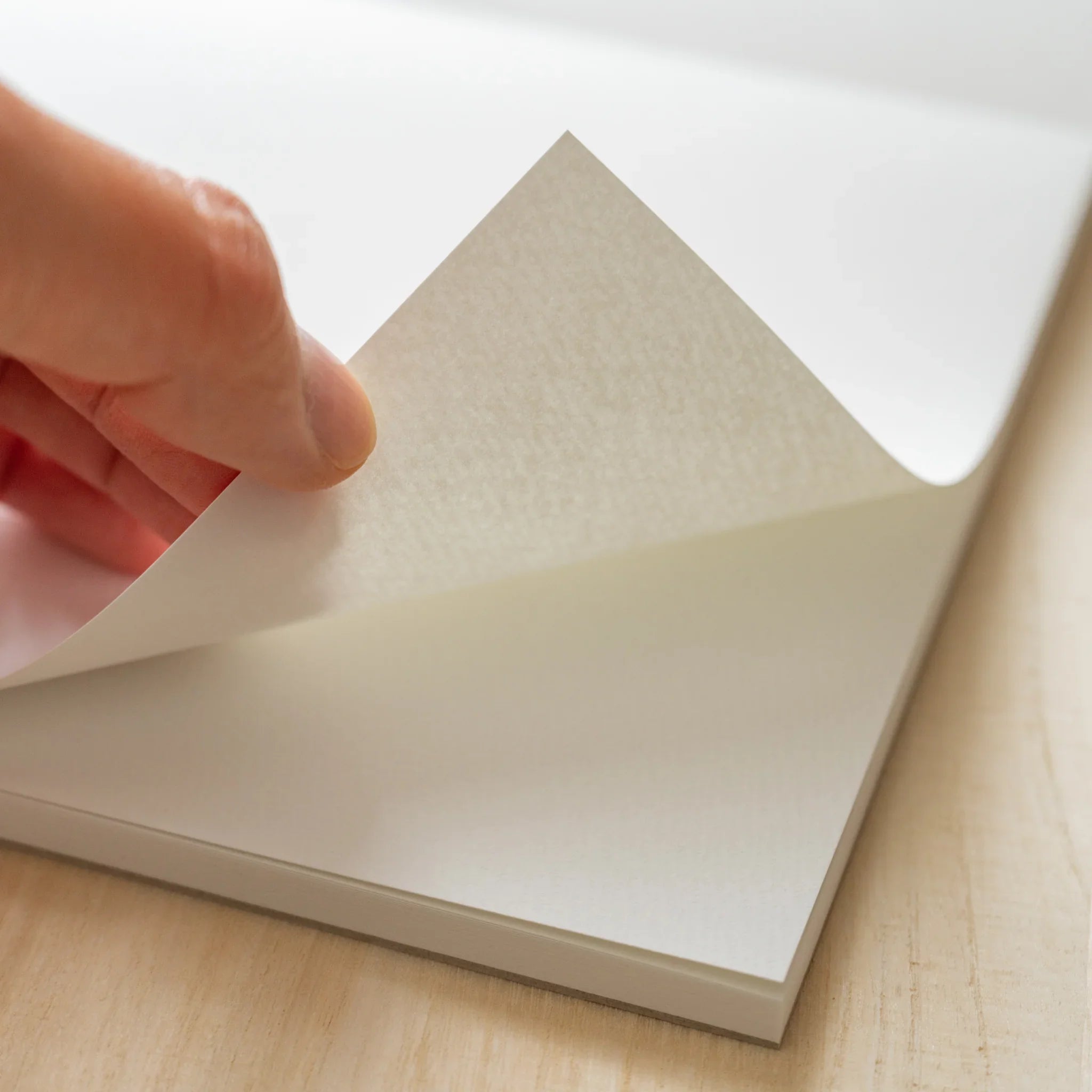 Maruman Zuan sketch pad, angled composition highlighting paper texture, stationery item from Japan with quality construction