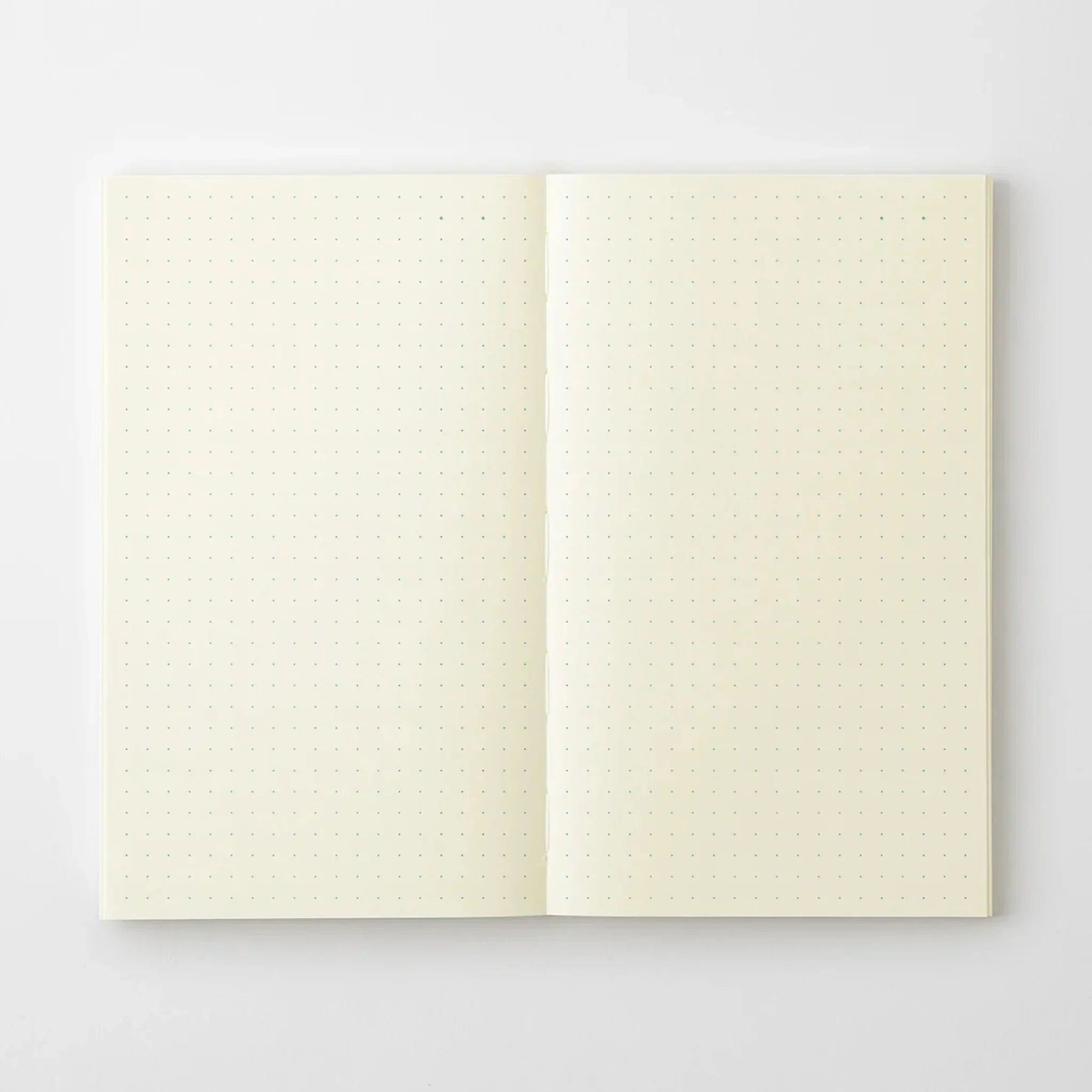 Midori MD B6 notebook, front cover detail showing minimalist design, Japanese Midori MD notebook with smooth cream-colored