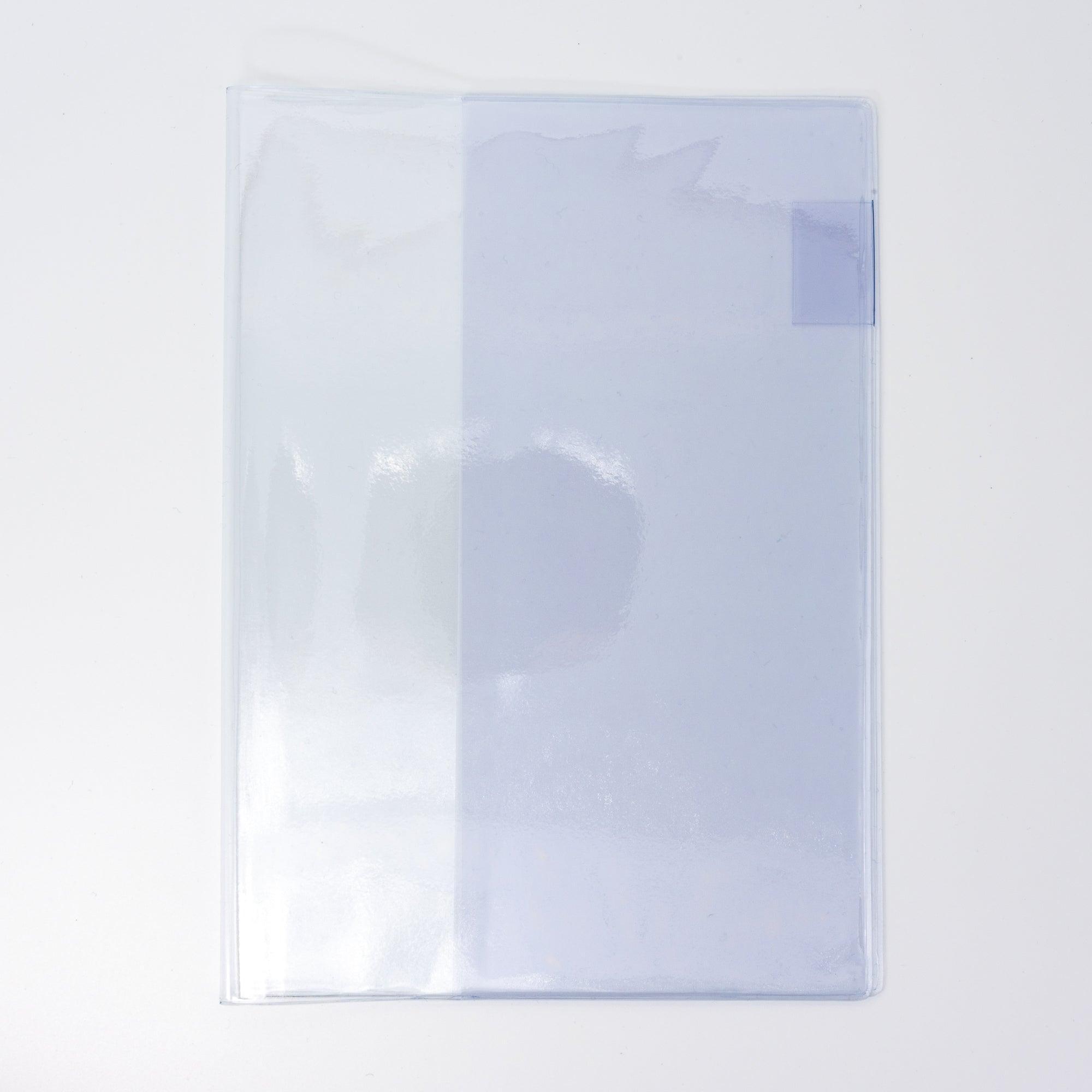 A fully closed MD notebook with a transparent lavender cover, emphasizing its minimalistic design as Japanese stationery.