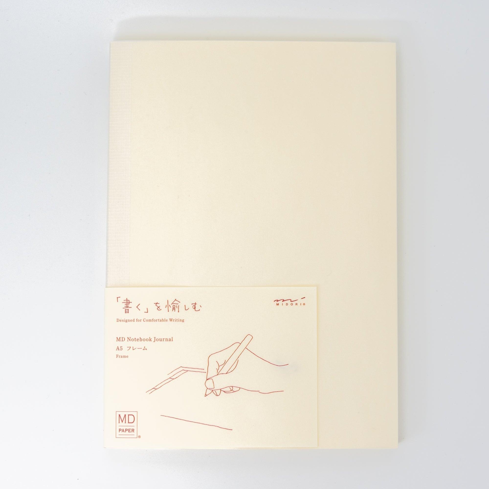 Front cover of an MD notebook journal with minimal design and label, showcasing Japanese stationery elegance.