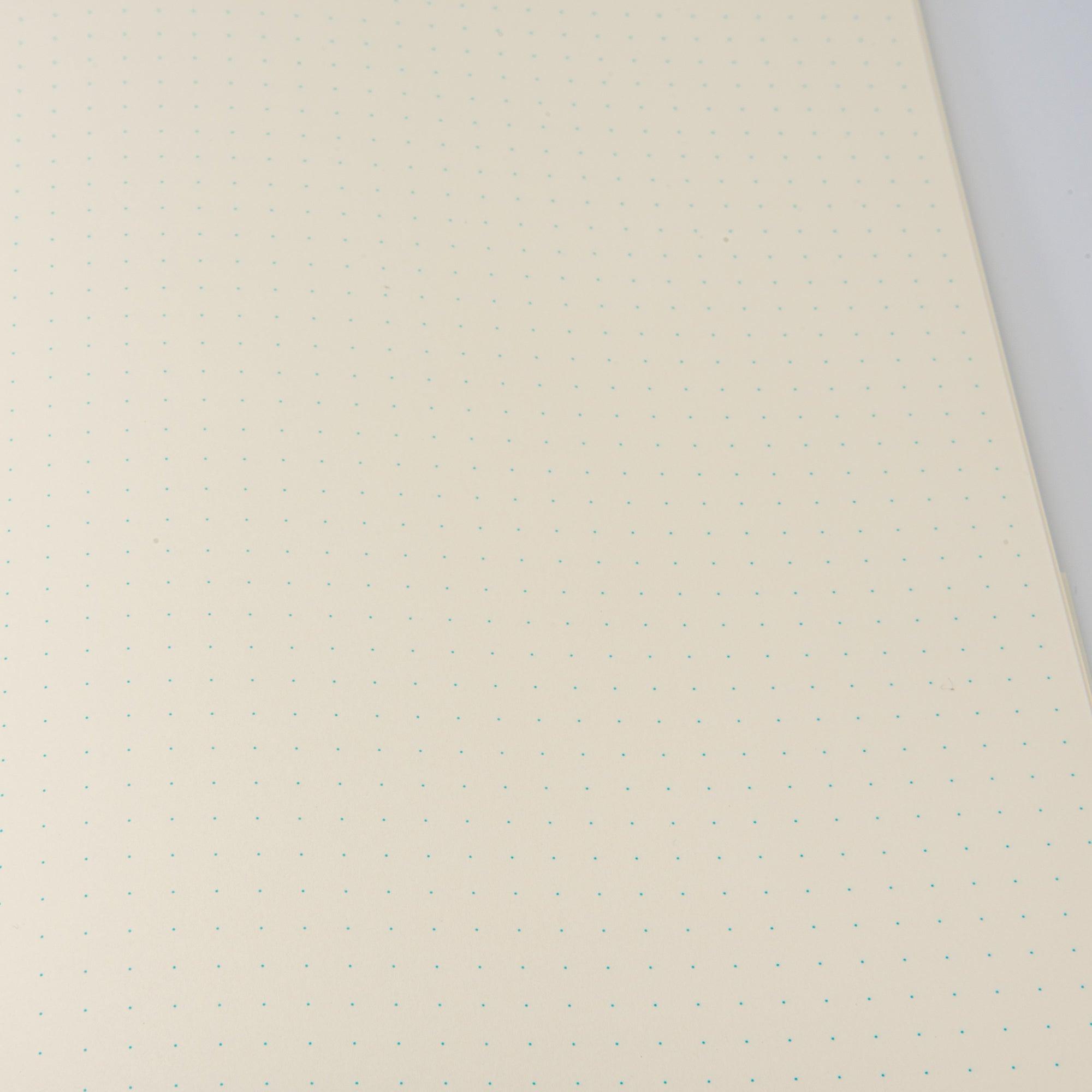 Close-up of an MD notebook's red frame detail, showcasing precise craftsmanship in Japanese stationery.