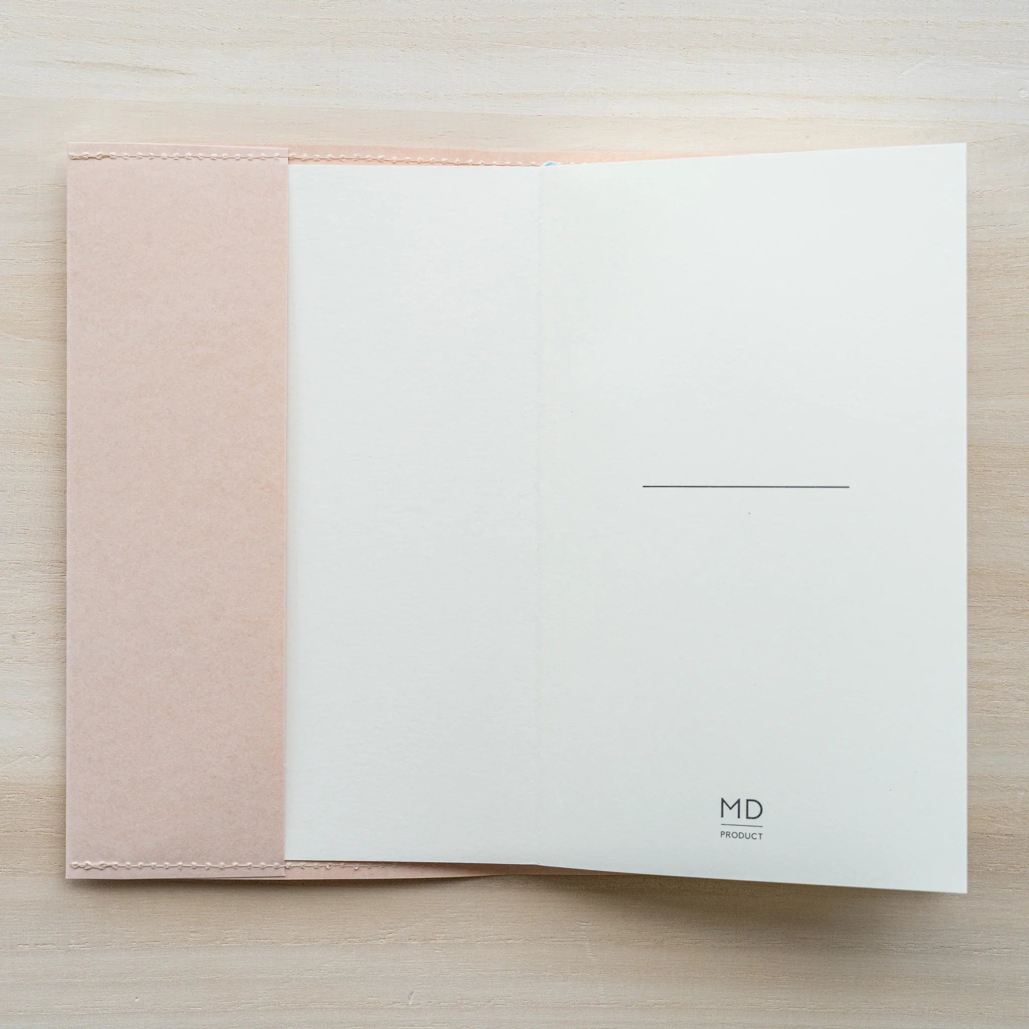 MD Product Paper Notebook Cover opened to inside showing first page of a Midori MD Paper Notebook B6 Slim.