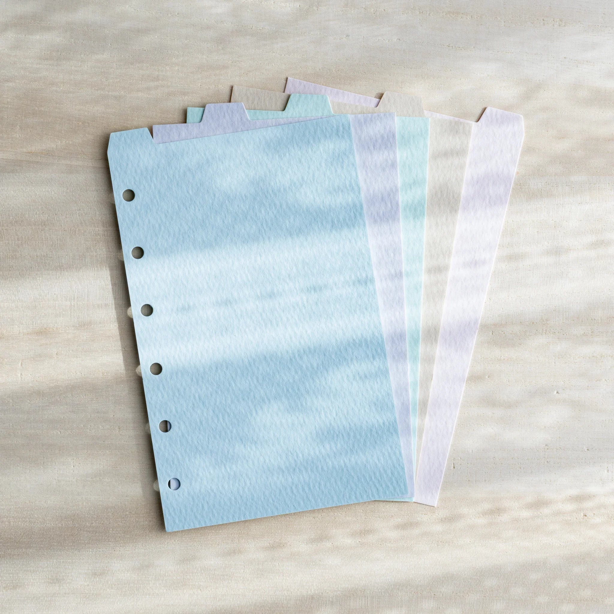 Japanese Stationery pastel index divider set fanned out on neutral background for mini 6 planners showing five top tabs.