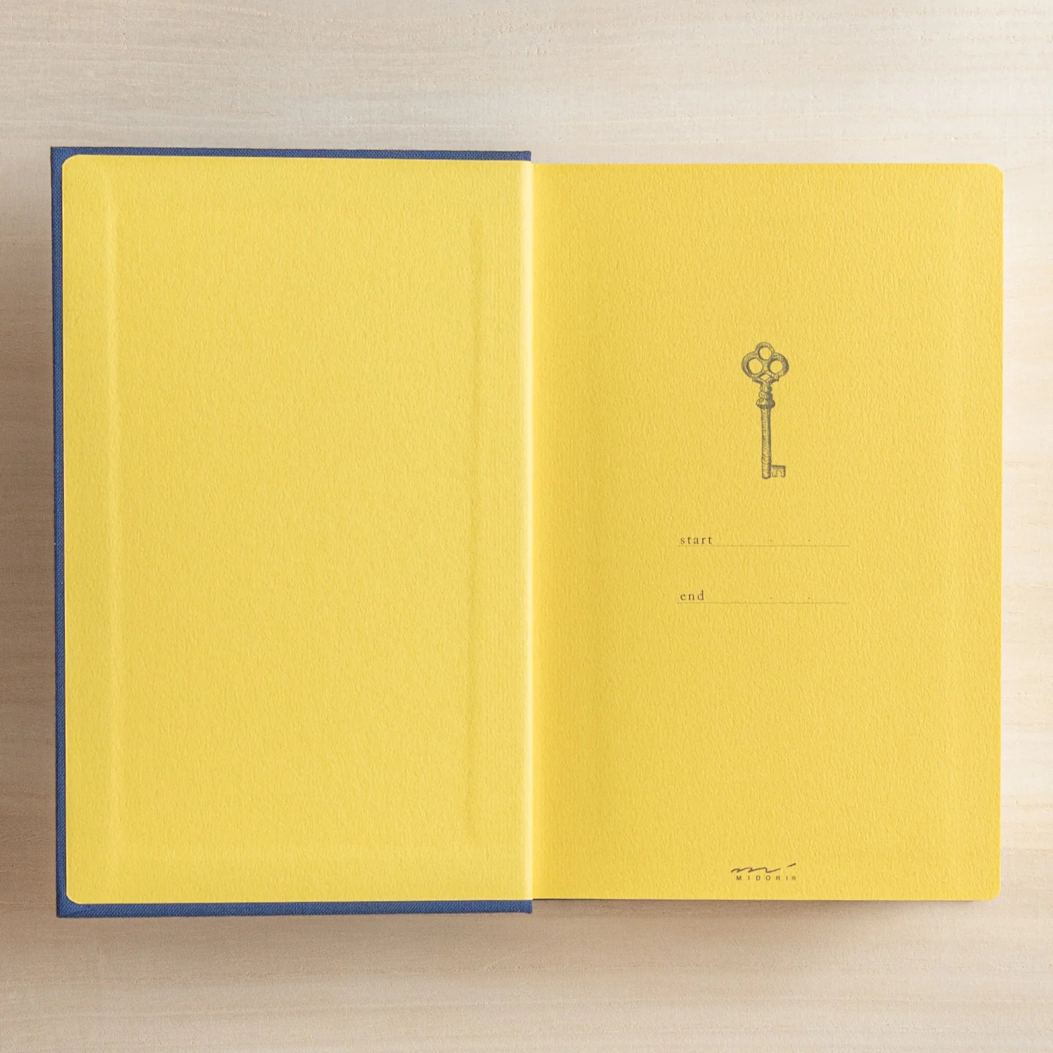 Midori 10-year journal, full page spread showing year divider tabs and dates, Japanese stationery item with quality