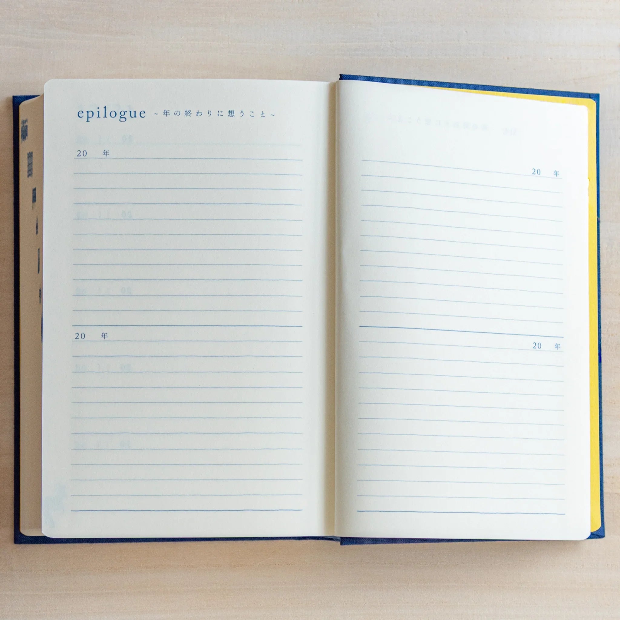 Open Midori Japanese journal 10-year diary gate design showing epilogue pages with lined sections for annual reflections.