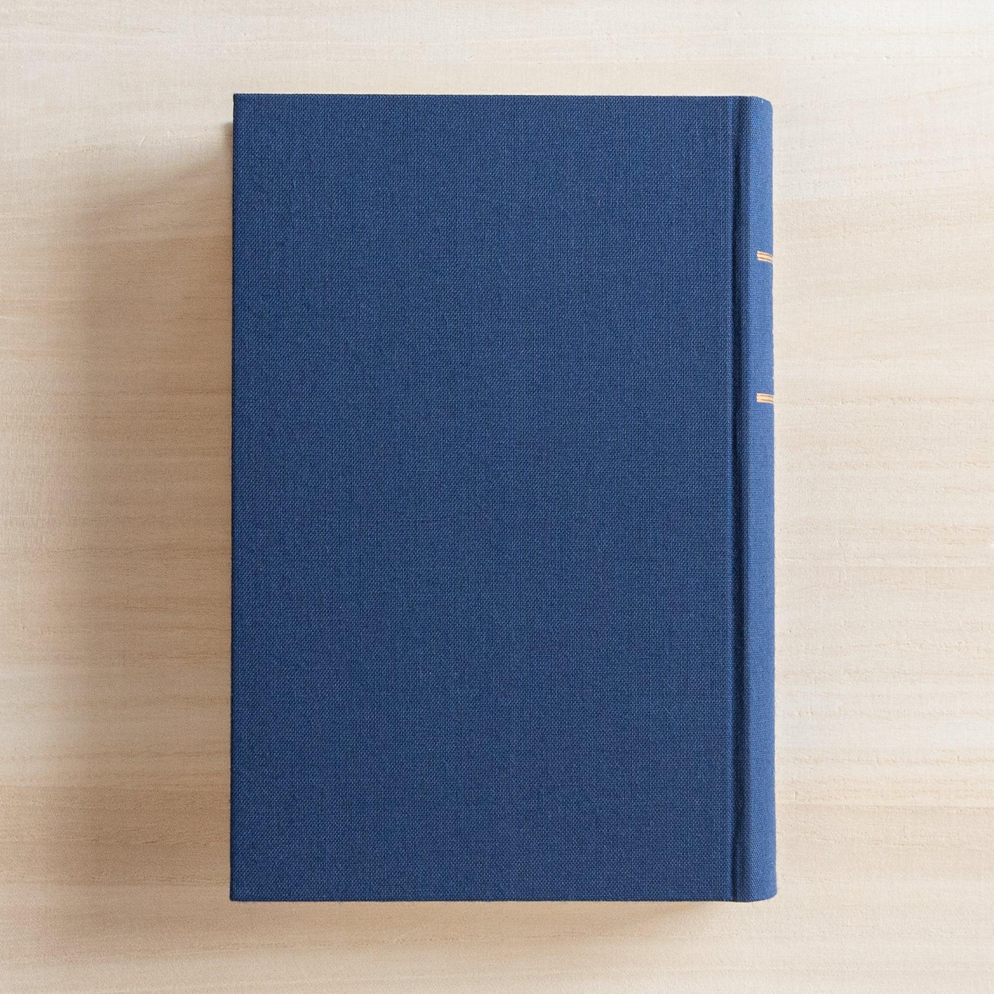 Midori 10-year journal, angled view displaying open pages and gate design cover, Japanese stationery product with quality