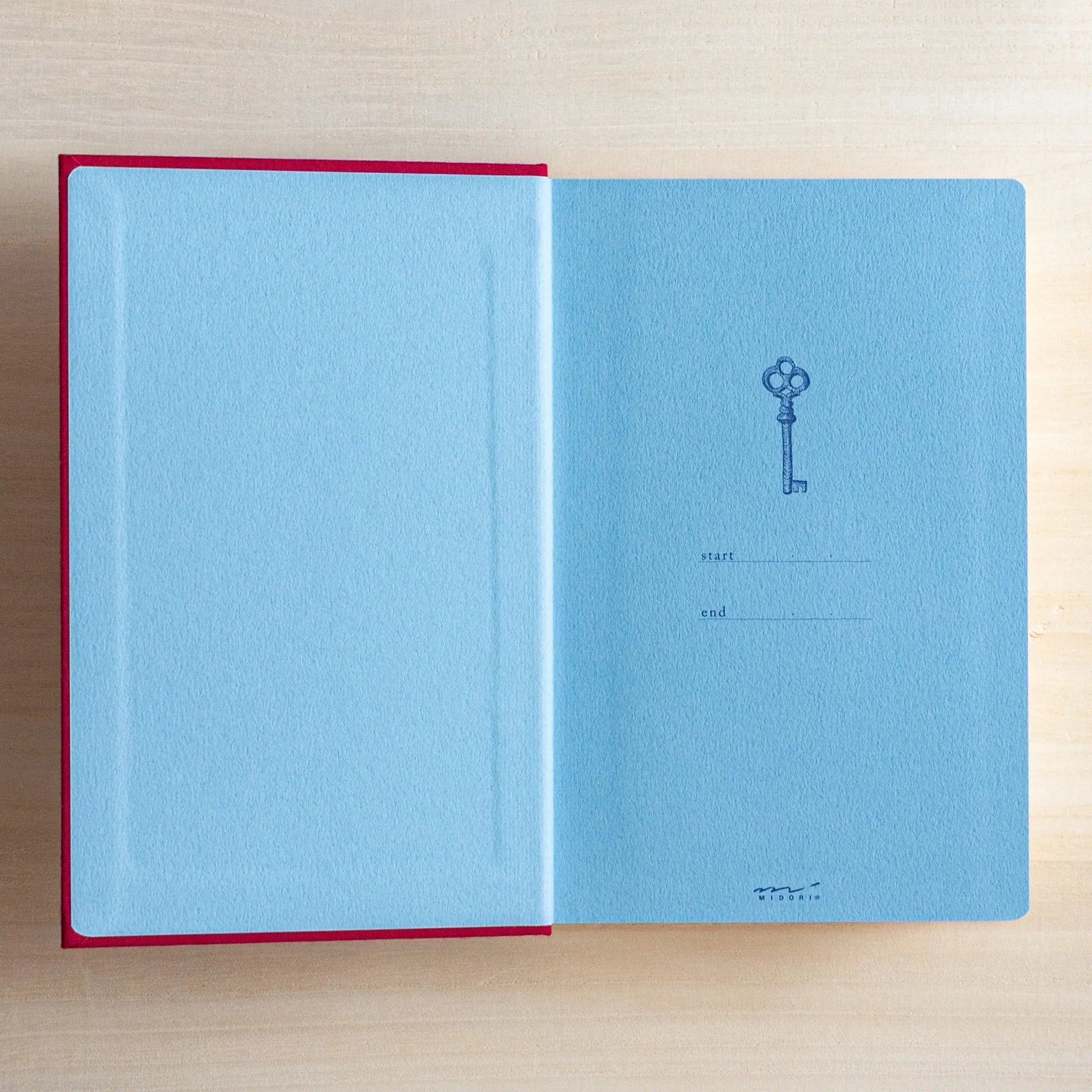 Midori 10-year journal, opened view showing paper color and page opacity, Japanese stationery with quality materials and