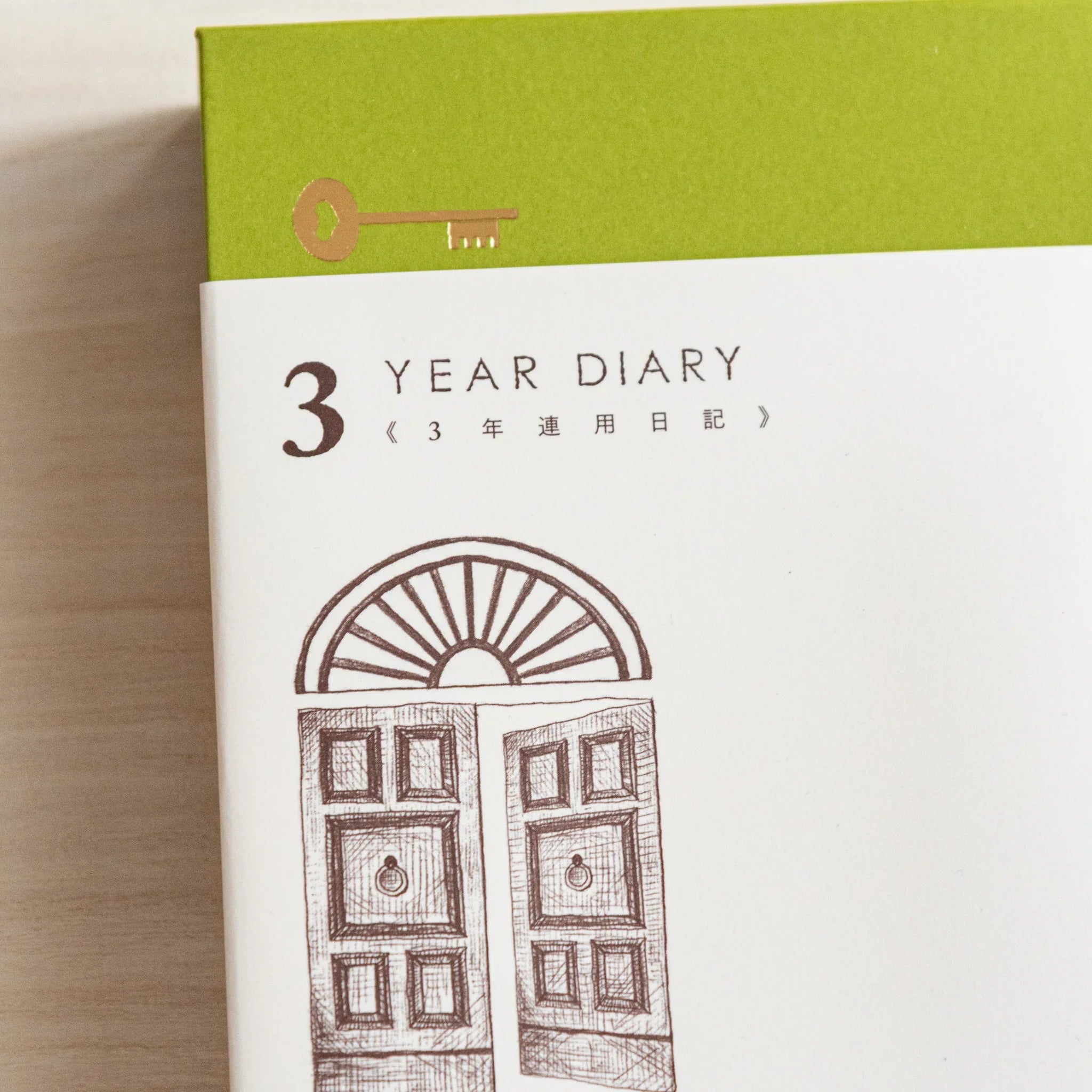 Midori 3-year journal, angled view displaying gate design and open pages, Midori 3-year planner journal with durable