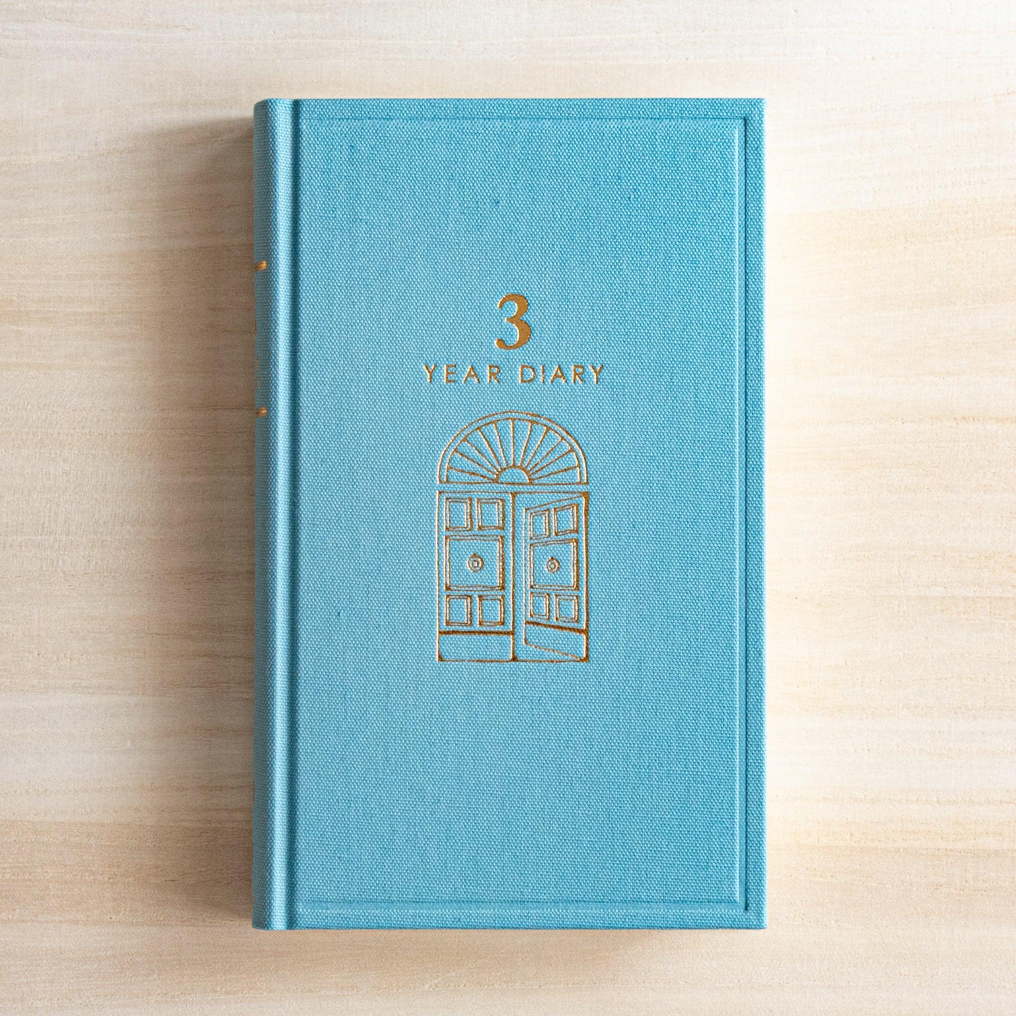 Midori 3-year journal, angled composition highlighting cover texture and design, Midori 3-year planner journal with durable