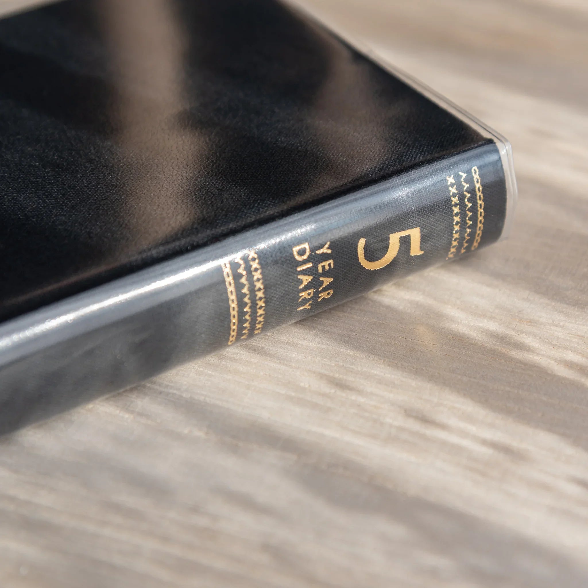 Midori 5-year journal, angled view displaying floral embroidery and pages, stationery item from Japan with quality