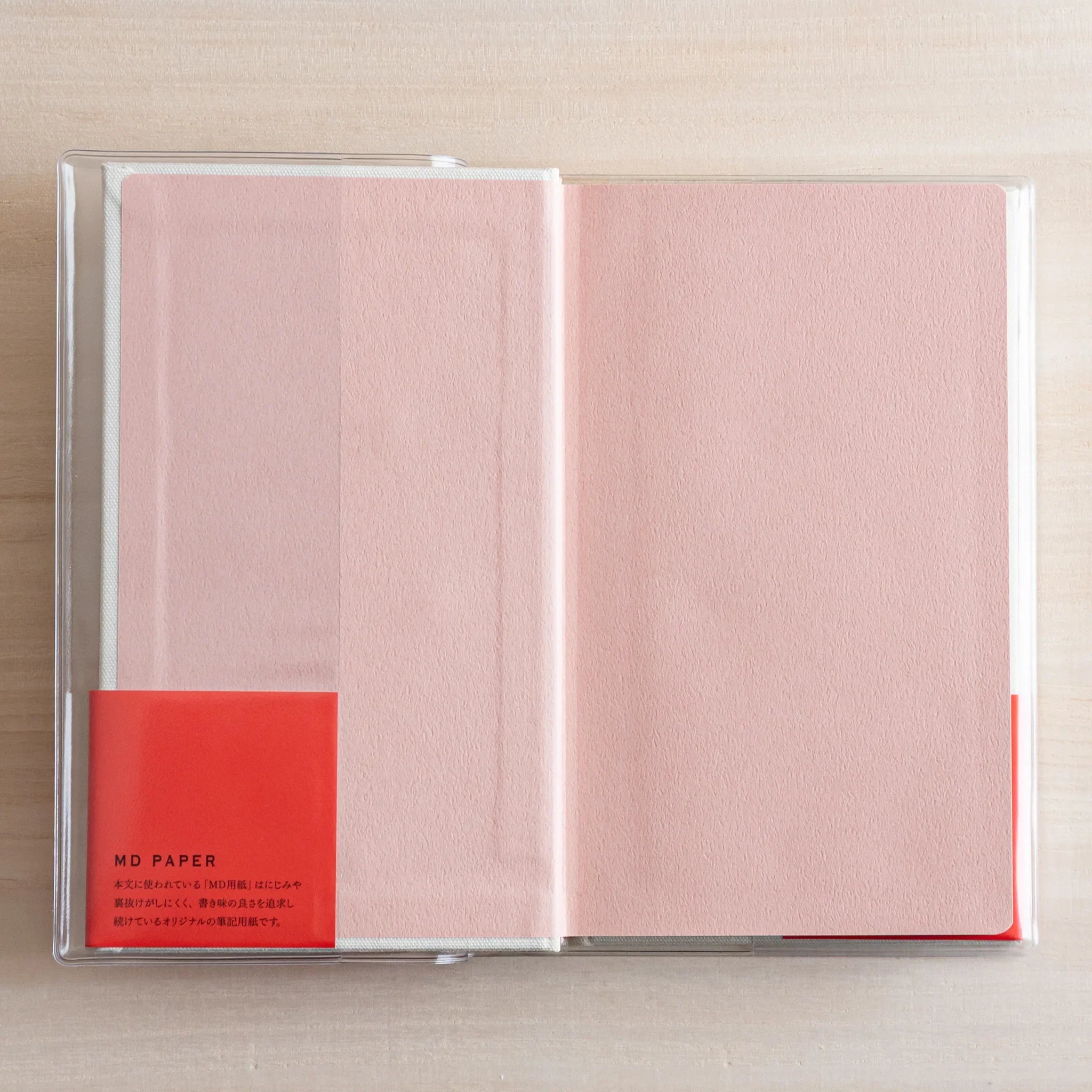Midori 5-year journal, opened pages showing yearly date sections and line format, Japanese stationery with quality materials
