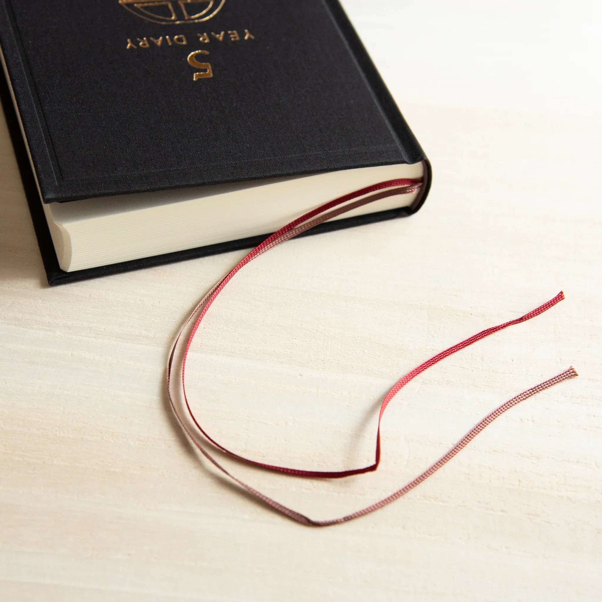 Midori 5 Year Journal Gate Design Japanese Journal with two ribbon bookmarks visible near the bottom edge.