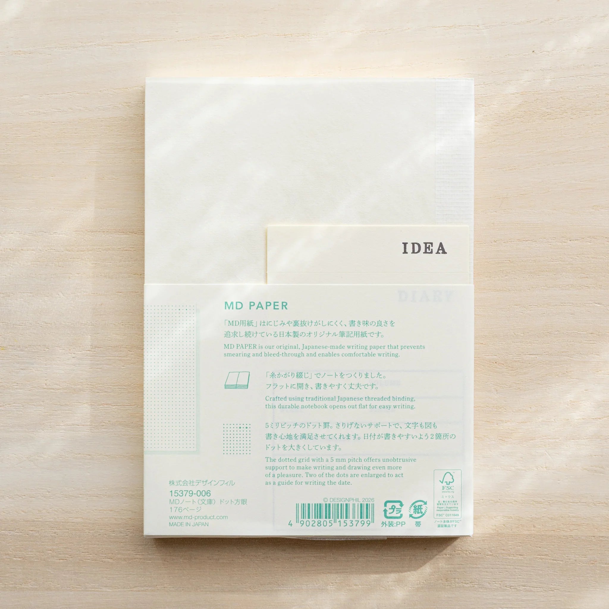 Midori MD Notebook A6 Dot Grid back cover through glassine, showing MD Paper description in teal, barcode, Made in Japan