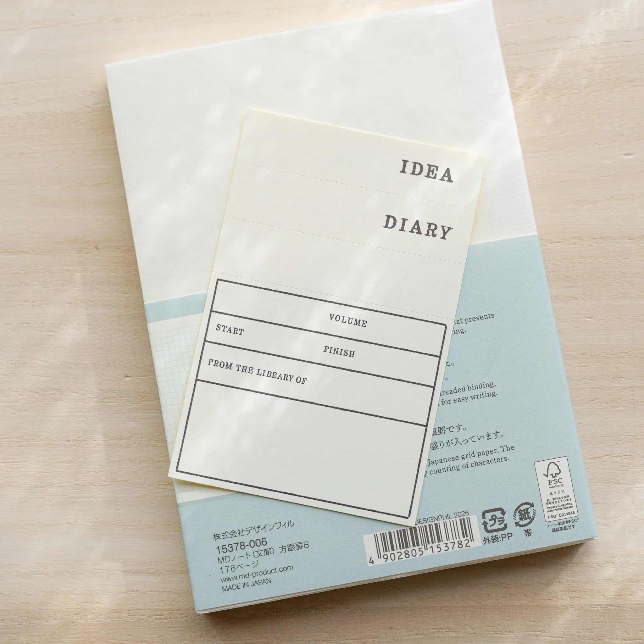 Midori MD Notebook A6 Grid back cover showing IDEA DIARY bookplate with VOLUME, START, FINISH fields, teal MD Paper section