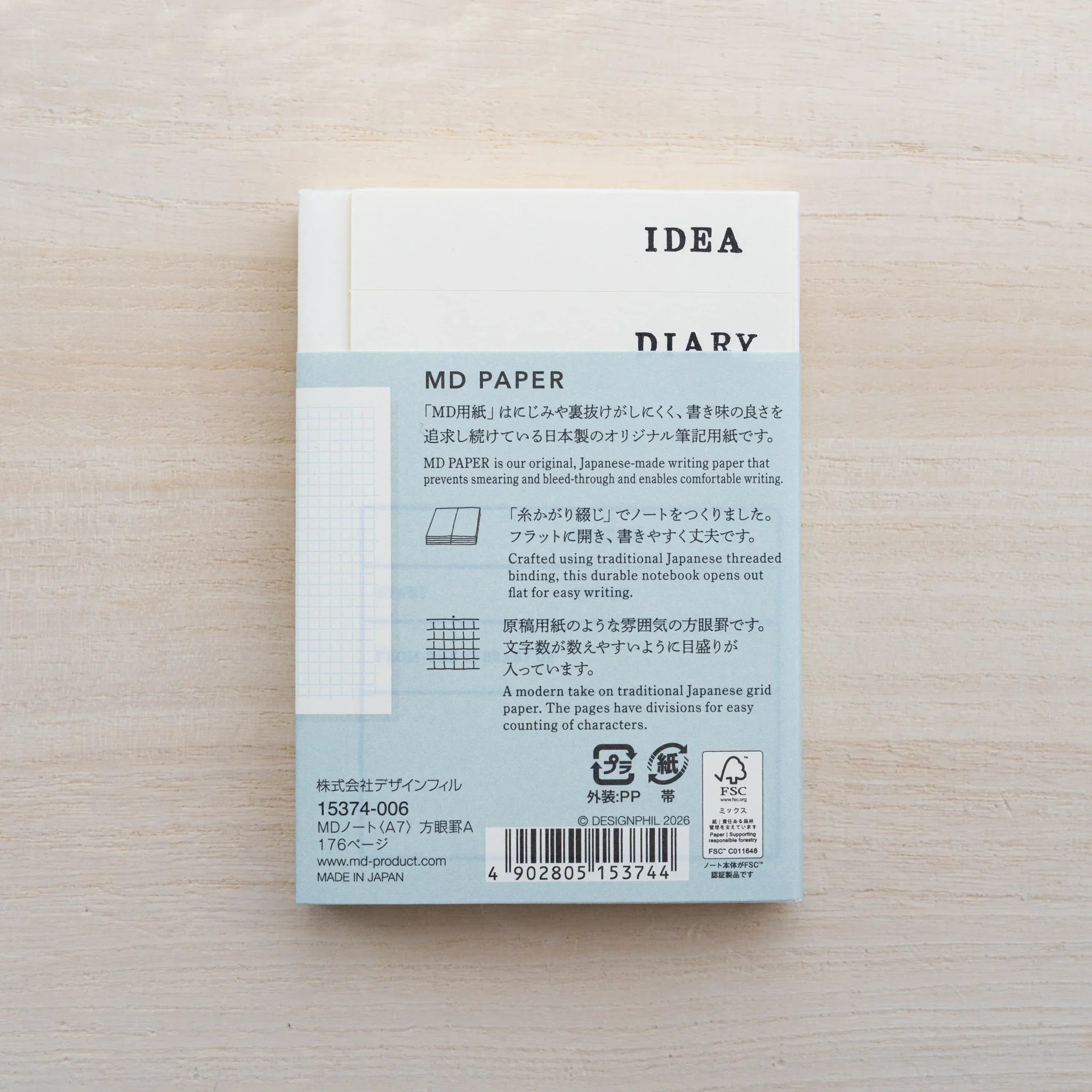 Back of MD Notebook A7 with MD PAPER belly band and IDEA DIARY card with barcode