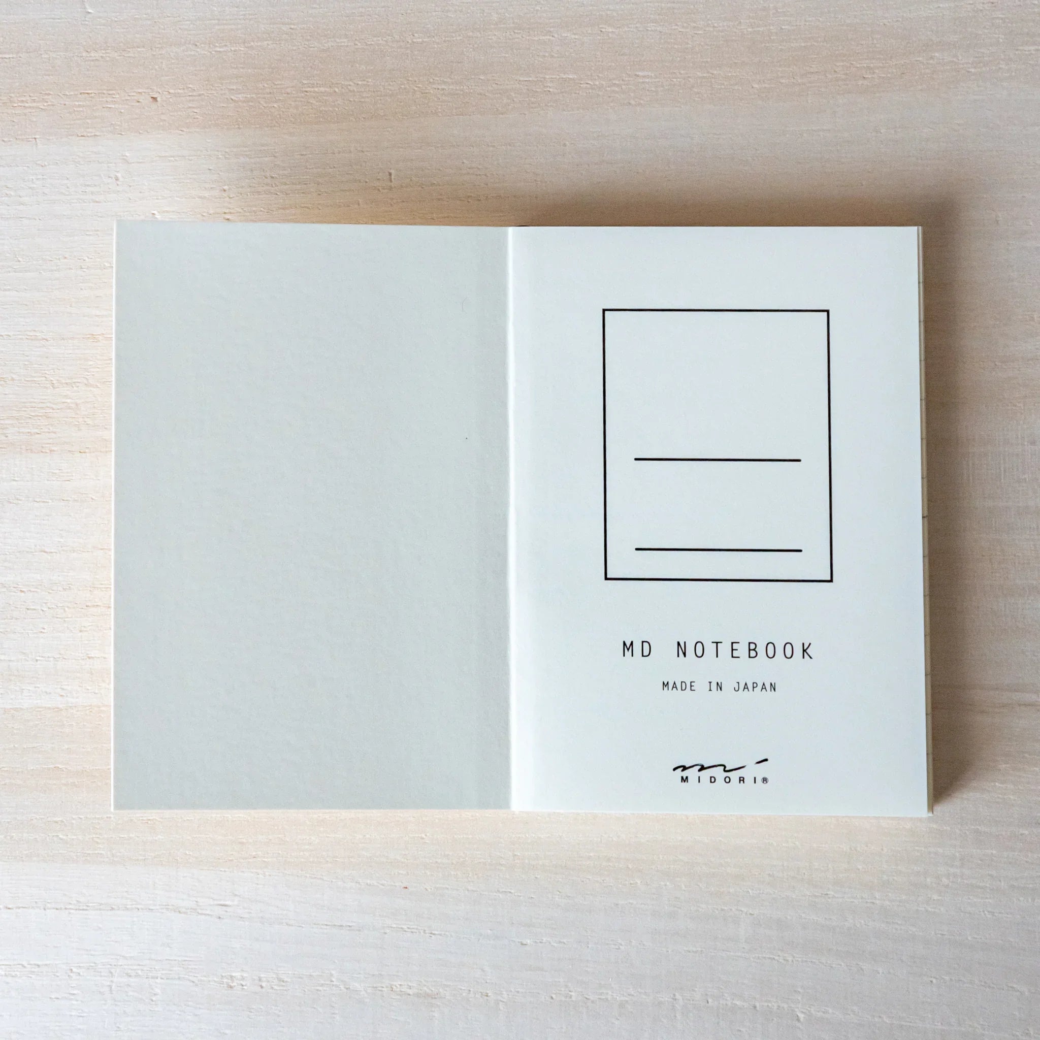 Midori MD A7 notebook, flat lay displaying open pages, Japanese Midori MD notebook with smooth cream-colored paper for