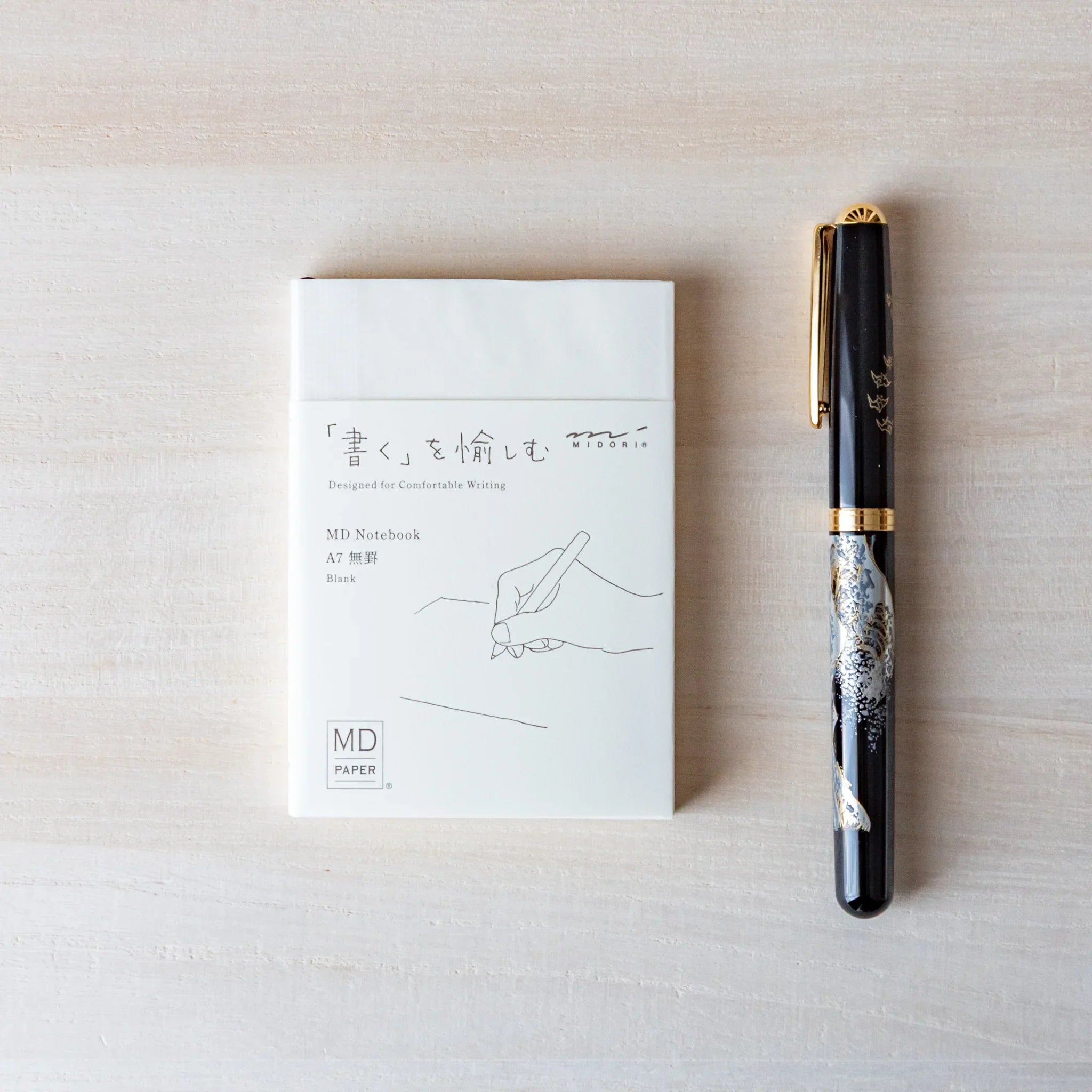 Midori MD A7 pocket-sized notebook, closed front cover showing small design, Japanese Midori MD notebook with smooth