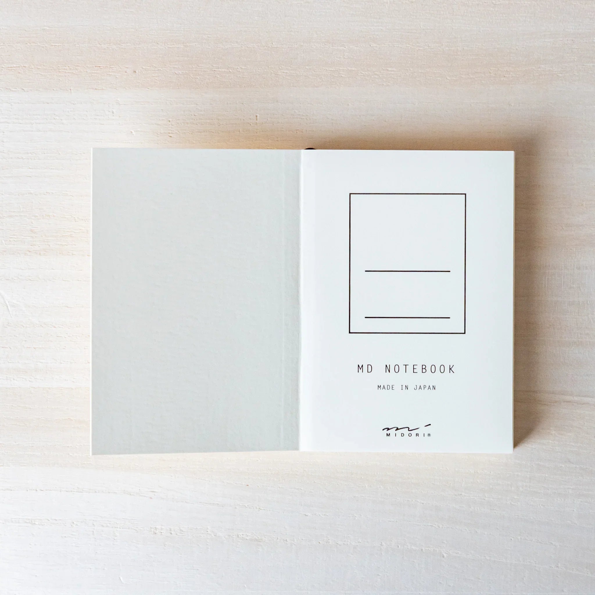 Japanese Notebook inside back cover of a Midori MD A7 notebook opened flat, showing the MD NOTEBOOK mark and Made in Japan text.