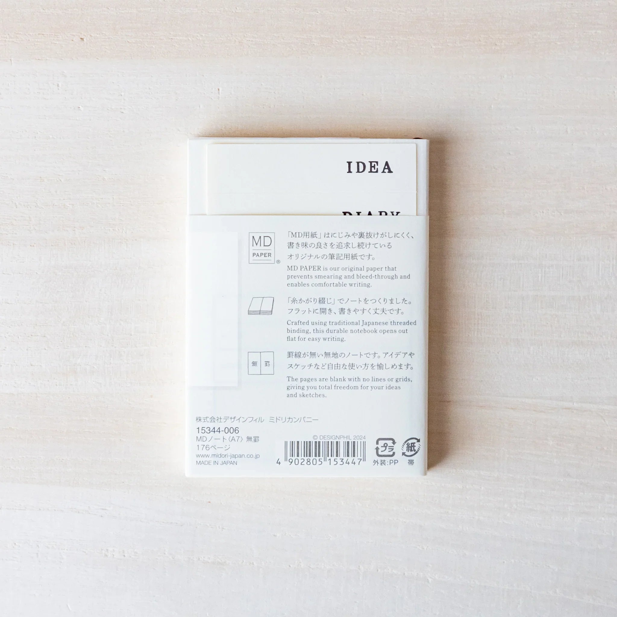 Japanese Notebook back view of a Midori MD A7 notebook with an IDEA DIARY insert and MD Paper information band.