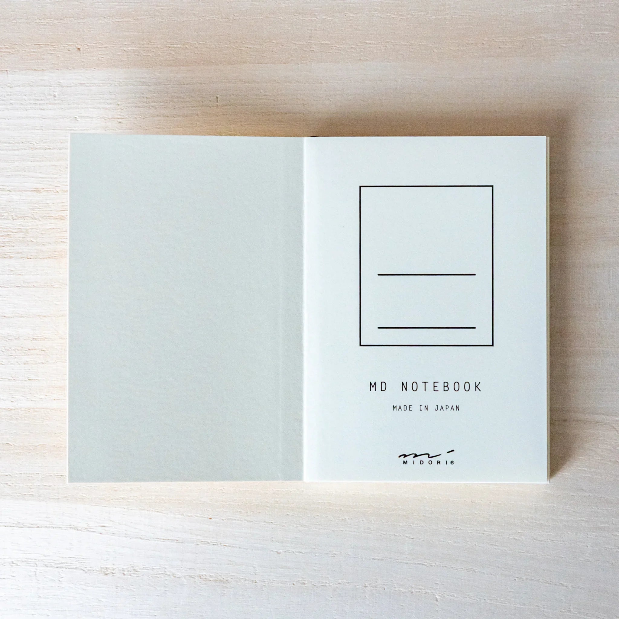 Midori MD A7 notebook, angled view of opened pocket-sized A7 notebook, Japanese Midori MD notebook with cotton-smooth paper