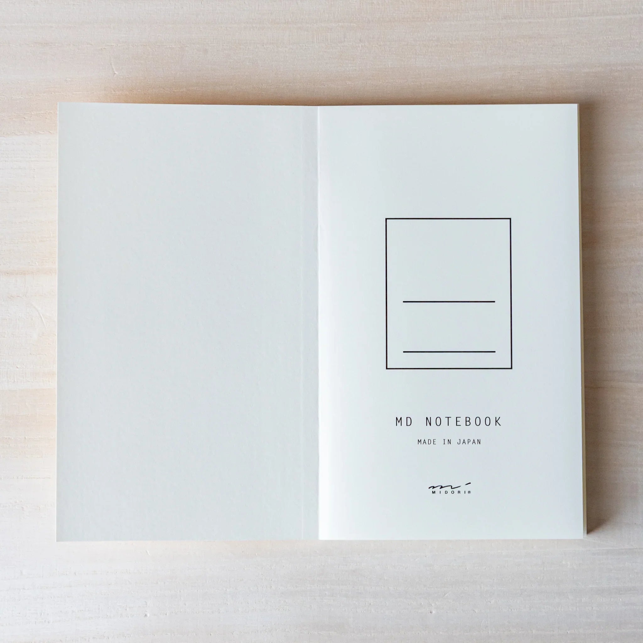 Japanese Notebook inside back cover of a Midori MD B6 notebook, opened flat to show the MD NOTEBOOK mark and Made in Japan text.