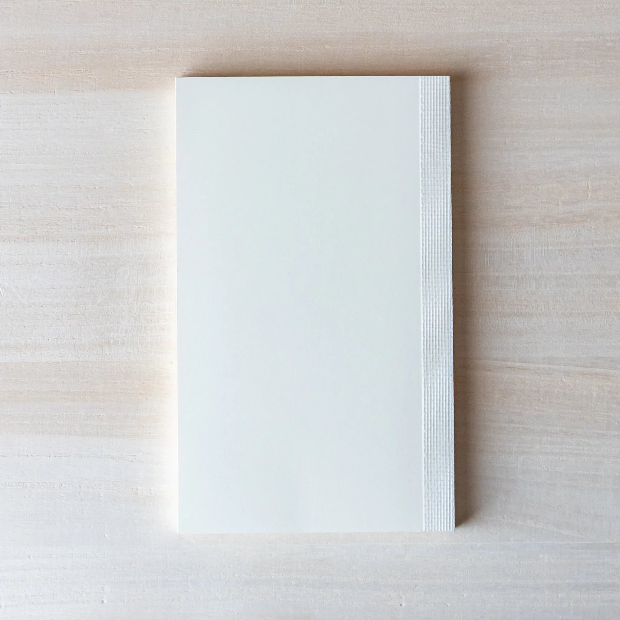 Japanese Notebook cover close-up of a Midori MD B6 notebook with embossed MD PAPER logo.