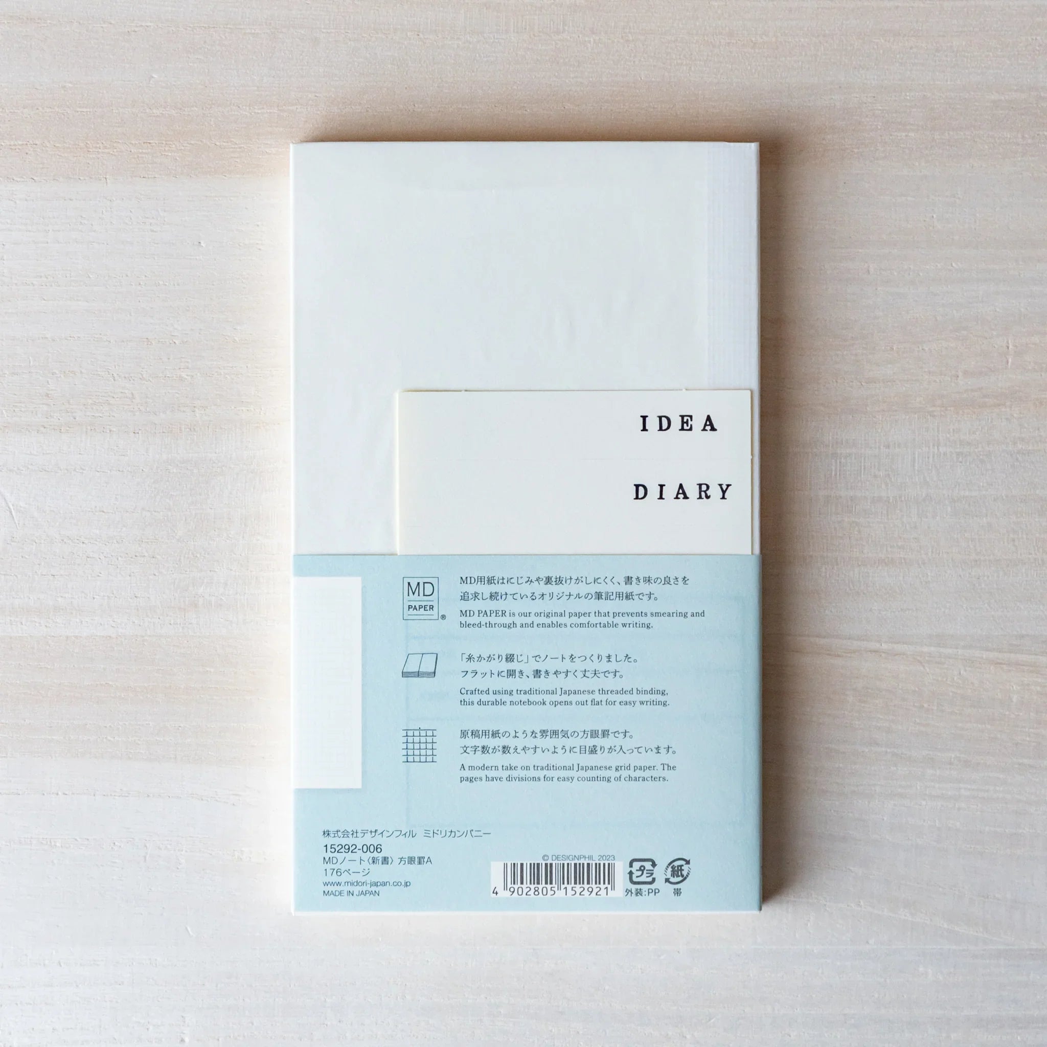 Midori MD B6 notebook, spread showing multiple pages, MD Notebook from Midori with thick cream paper and plain, grid, or