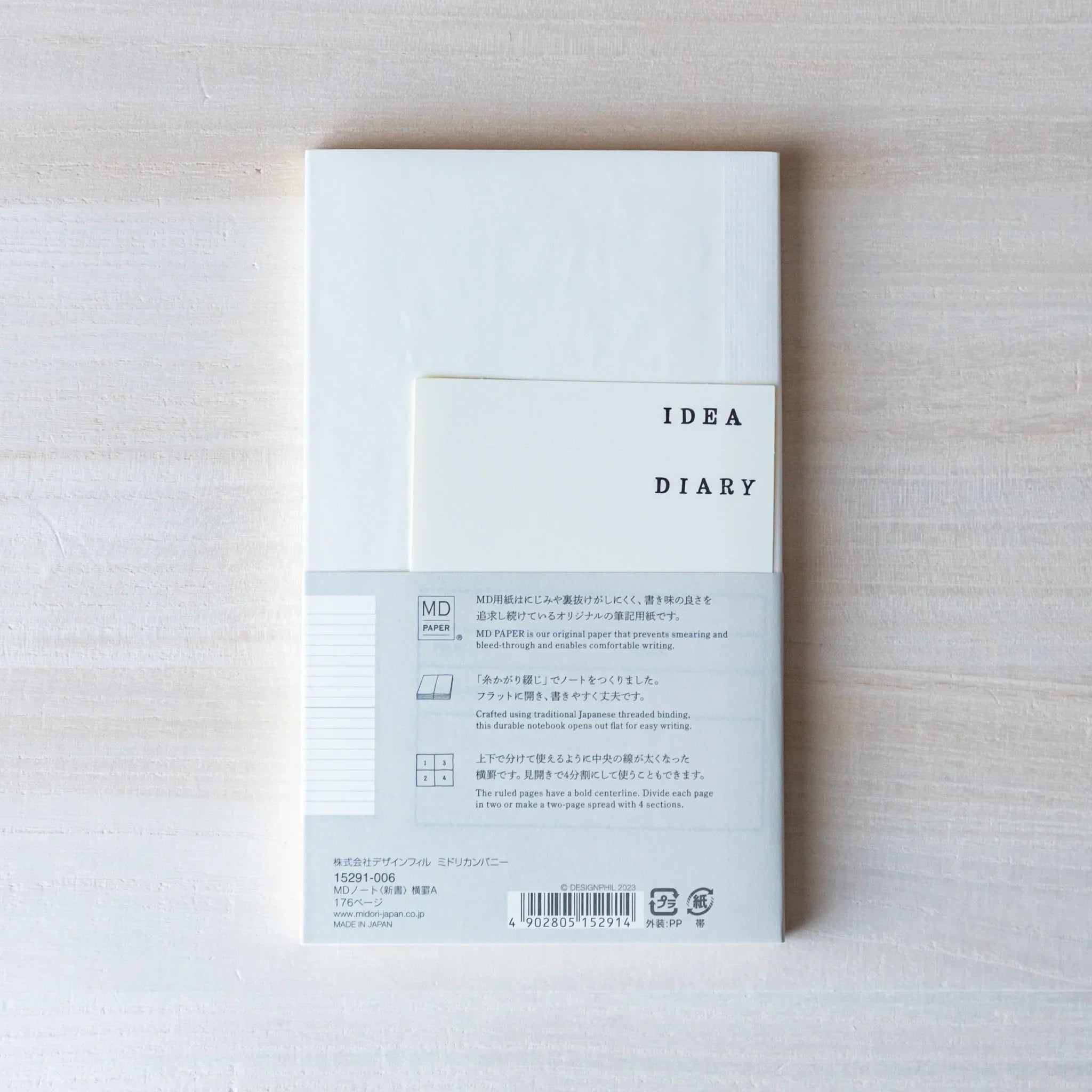 Japanese Notebook back view of a Midori MD B6 notebook with an IDEA DIARY insert and MD Paper information band.